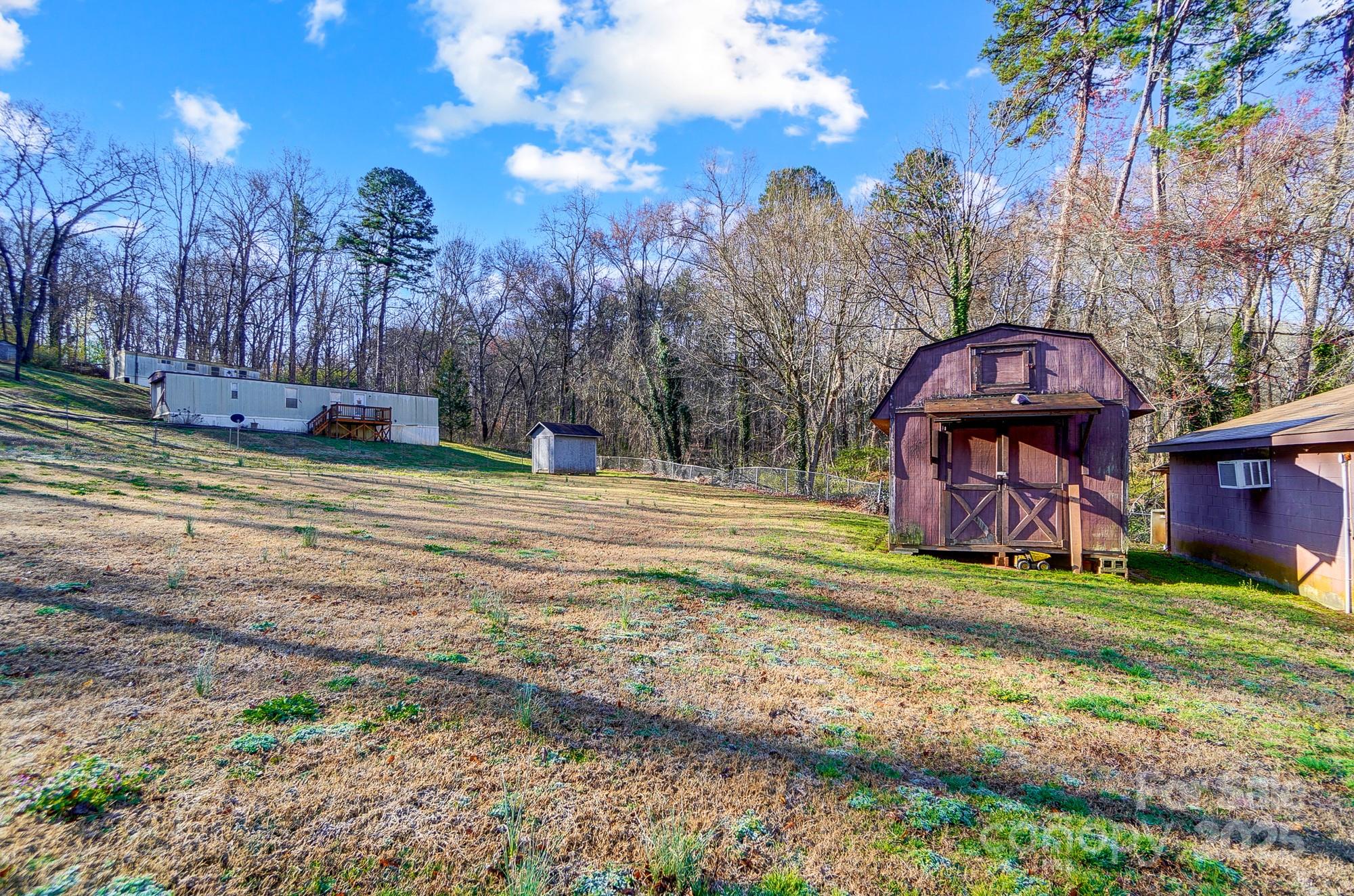 455 Pinhook Loop Road Gastonia, NC 28056 - Photo 14 of 15 a view of a yard with a house in the background