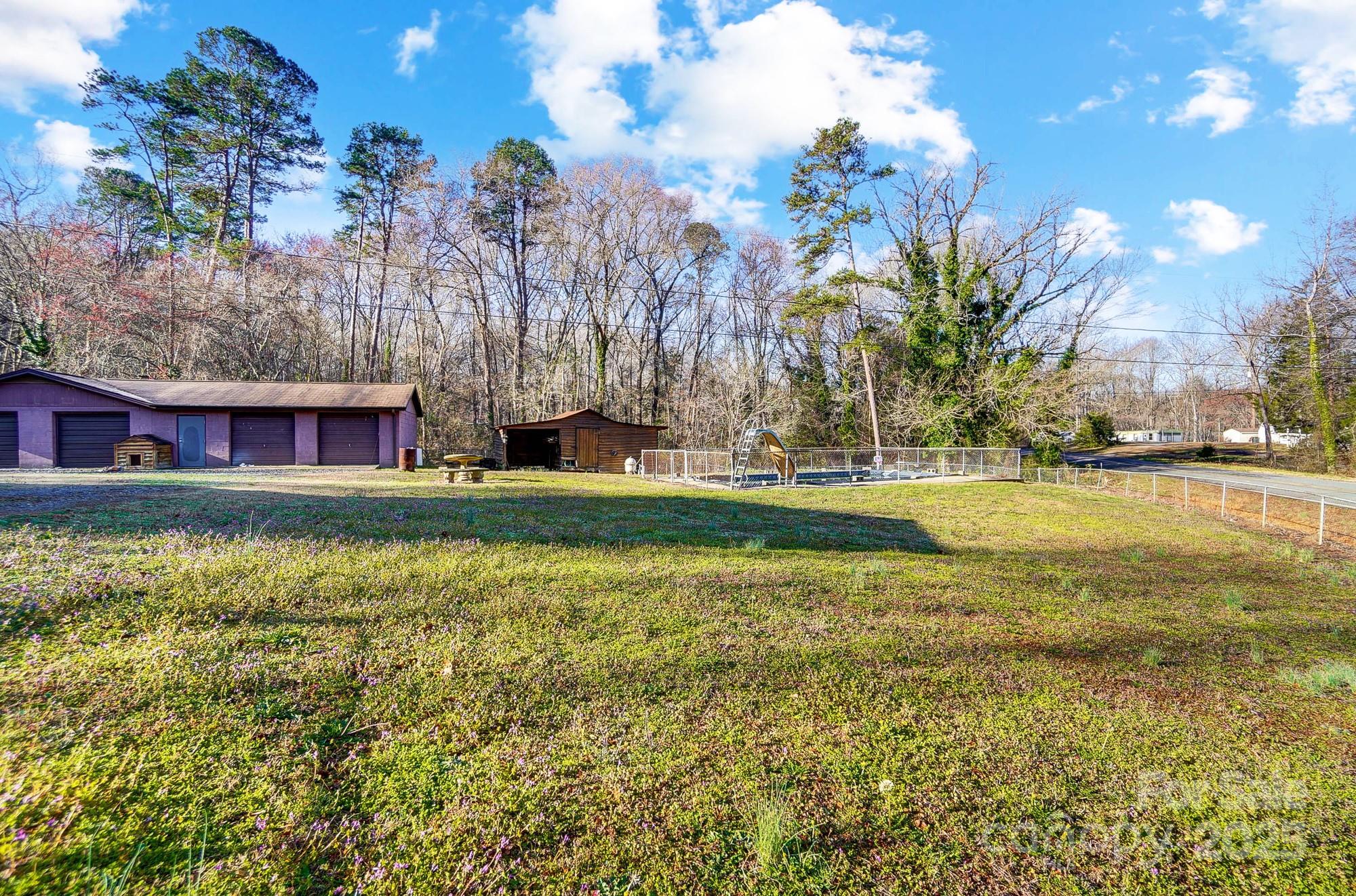 455 Pinhook Loop Road Gastonia, NC 28056 - Photo 15 of 15 a view of swimming pool with an outdoor space and seating area