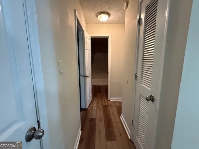 a view of a hallway with a room