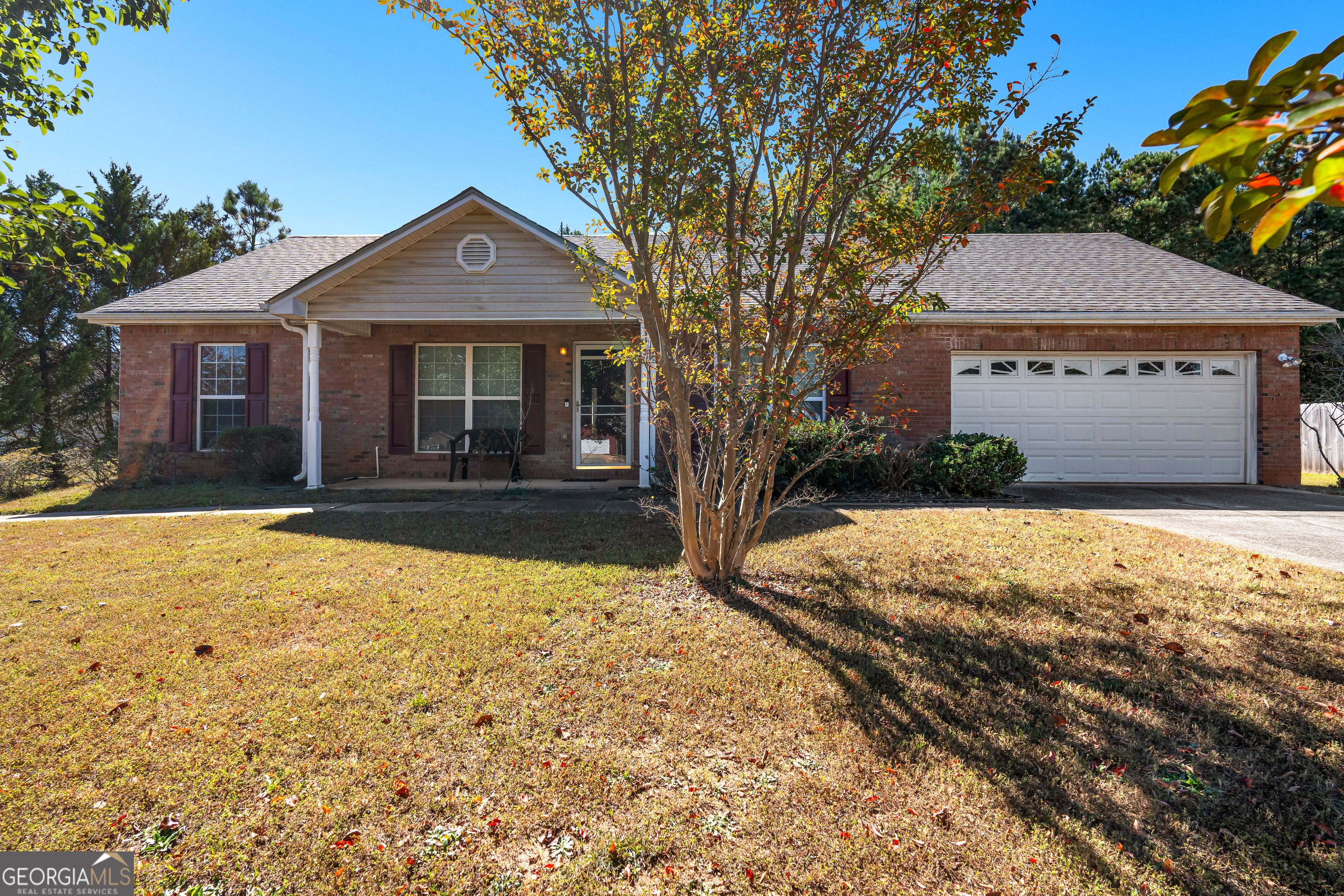 290 Whistle Way Locust Grove, GA 30248 - Photo 1 of 1 a front view of a house with a yard