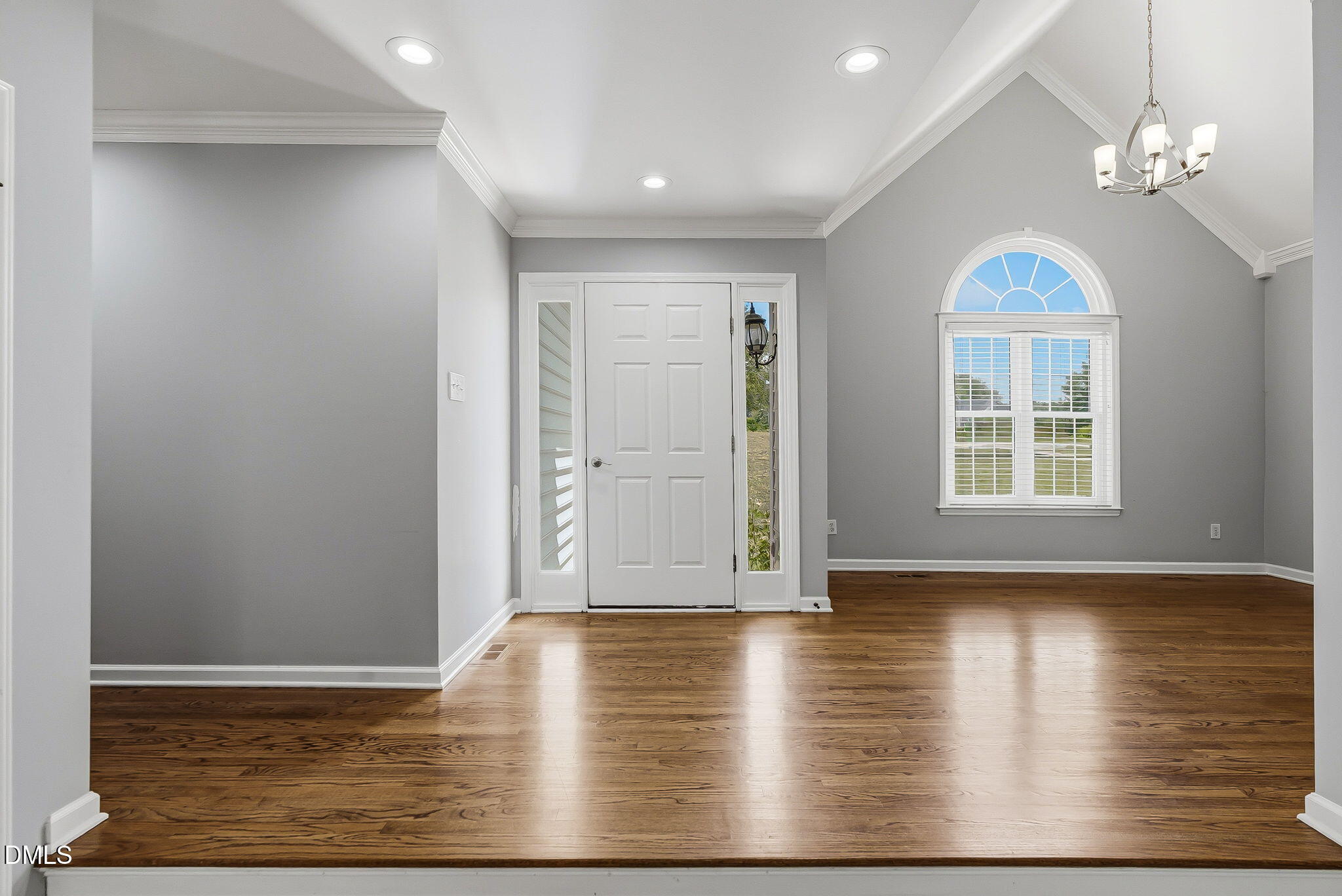 1112 Tyler Farms Drive Raleigh, NC 27603 - Photo 11 of 78 a view of an empty room with wooden floor and a window