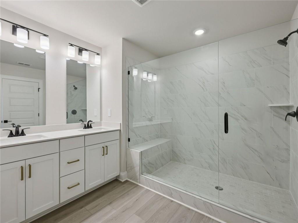 508 McCrae Road Lawrenceville, GA 30045 - Photo 16 of 22 a bathroom with a double vanity sink mirror and shower