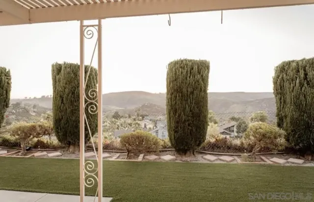 a view of a swimming pool with a yard