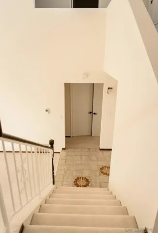 a view of a hallway with white walls