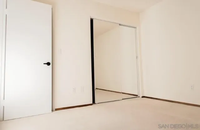 a view of a small space with wooden floor