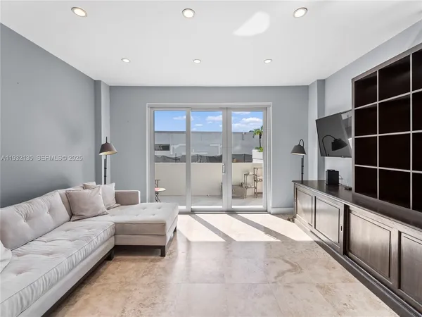a large bedroom with a bed and walk in closet
