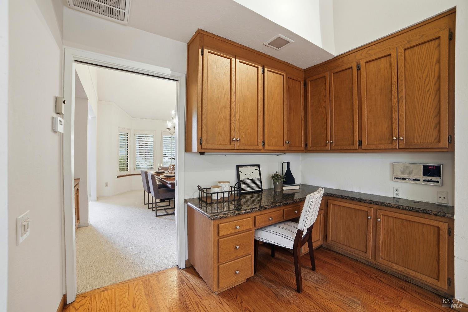 2656 Fir Park Way Santa Rosa, CA 95404 - Photo 21 of 51 a kitchen with a sink a stove cabinets and wooden floor