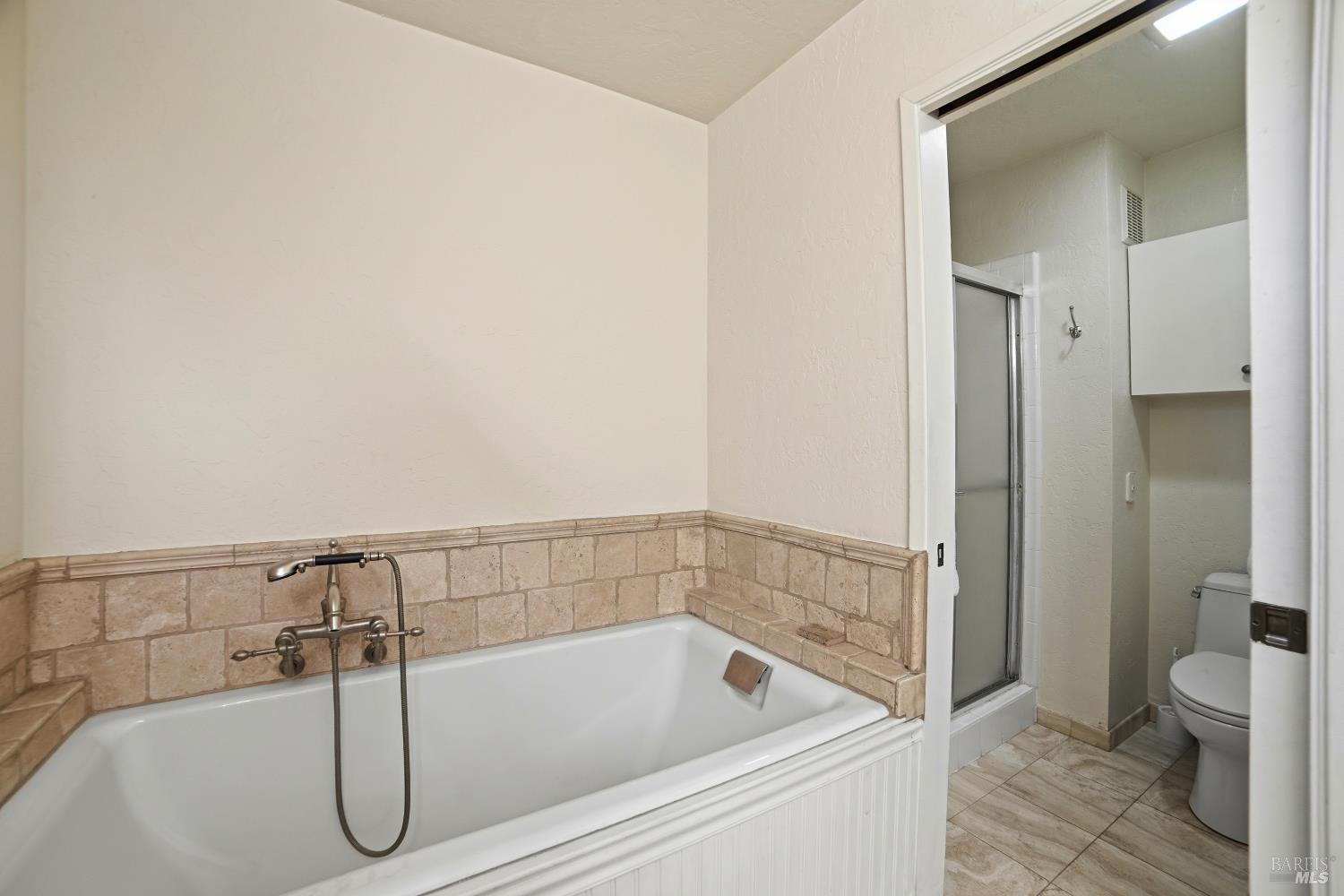 2656 Fir Park Way Santa Rosa, CA 95404 - Photo 34 of 51 a bathroom with a bath tub and a shower