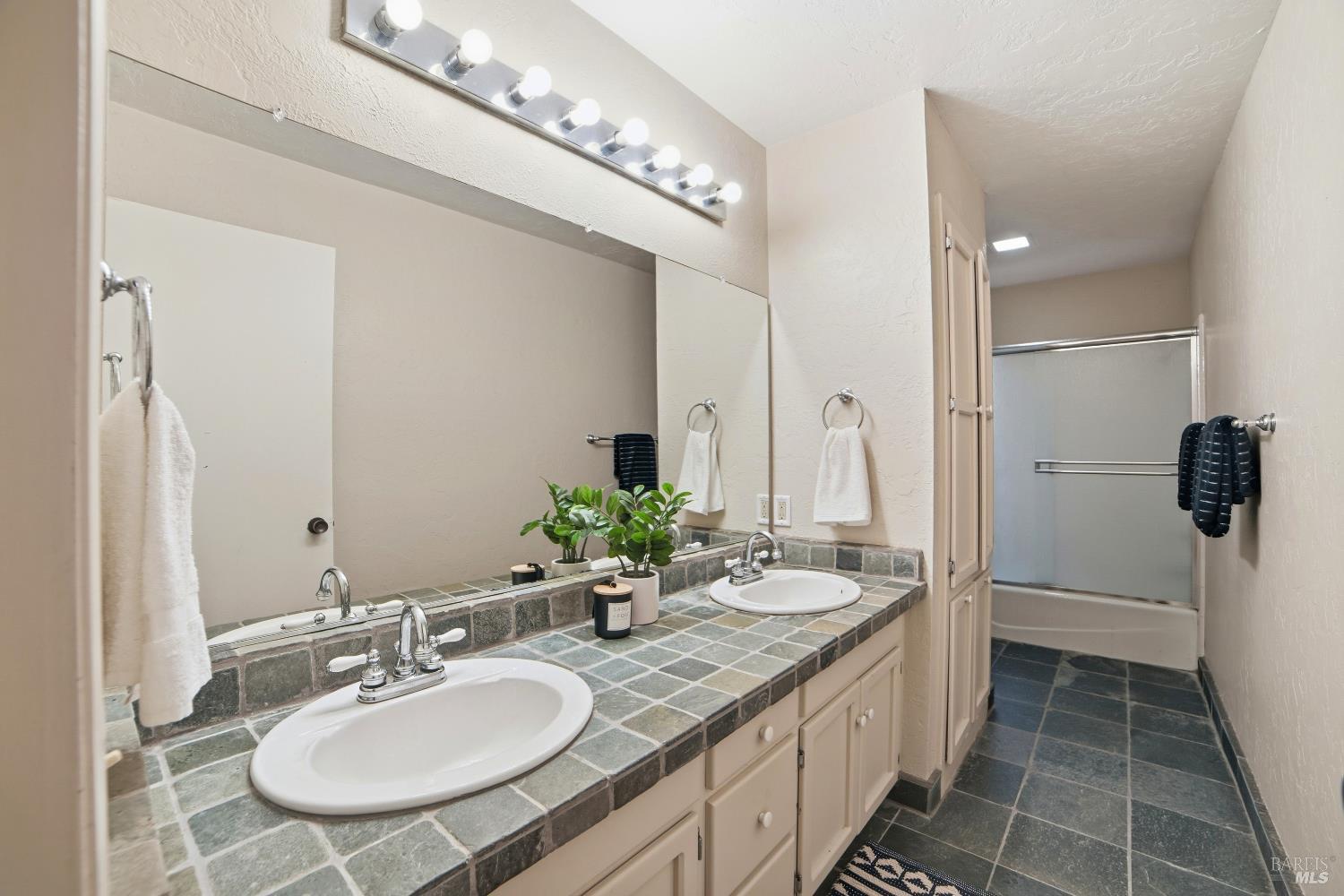 2656 Fir Park Way Santa Rosa, CA 95404 - Photo 36 of 51 a bathroom with a sink double vanity and a mirror
