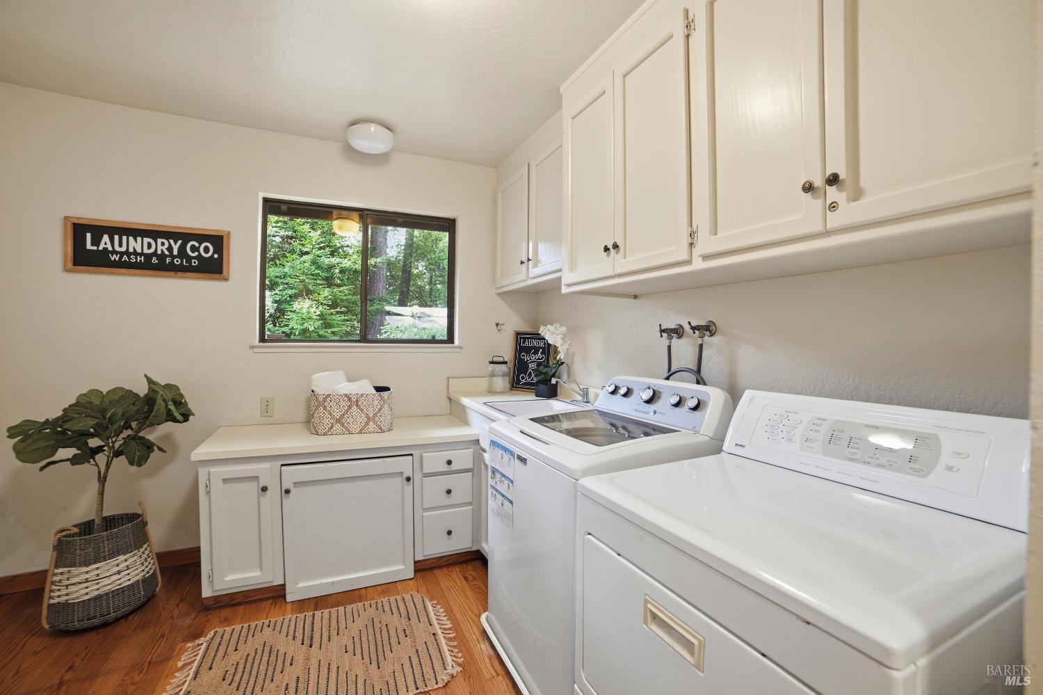 2656 Fir Park Way Santa Rosa, CA 95404 - Photo 38 of 51 a utility room with sink dryer and washer