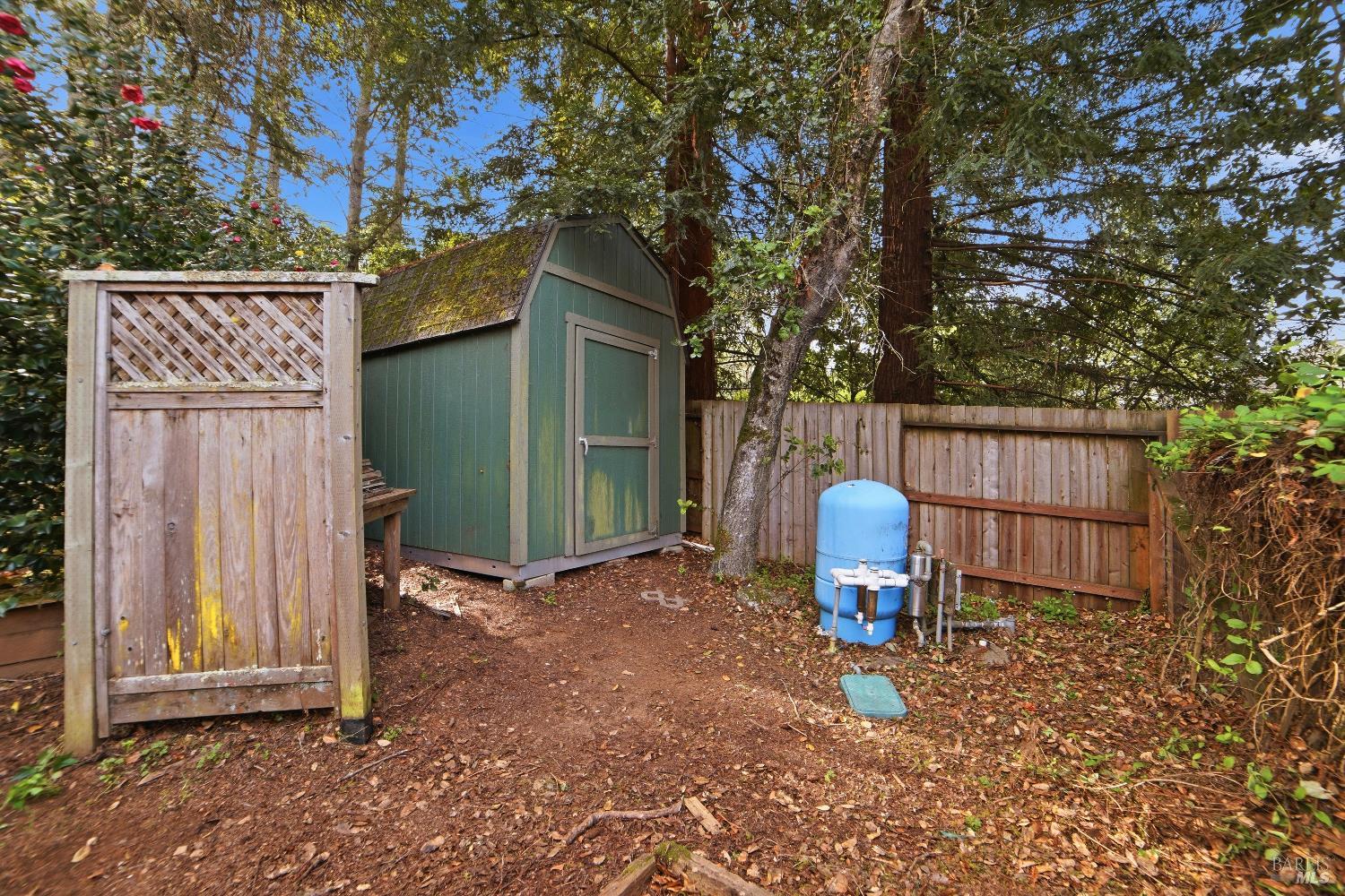 2656 Fir Park Way Santa Rosa, CA 95404 - Photo 49 of 51 a view of backyard with a table and chairs and a large tree