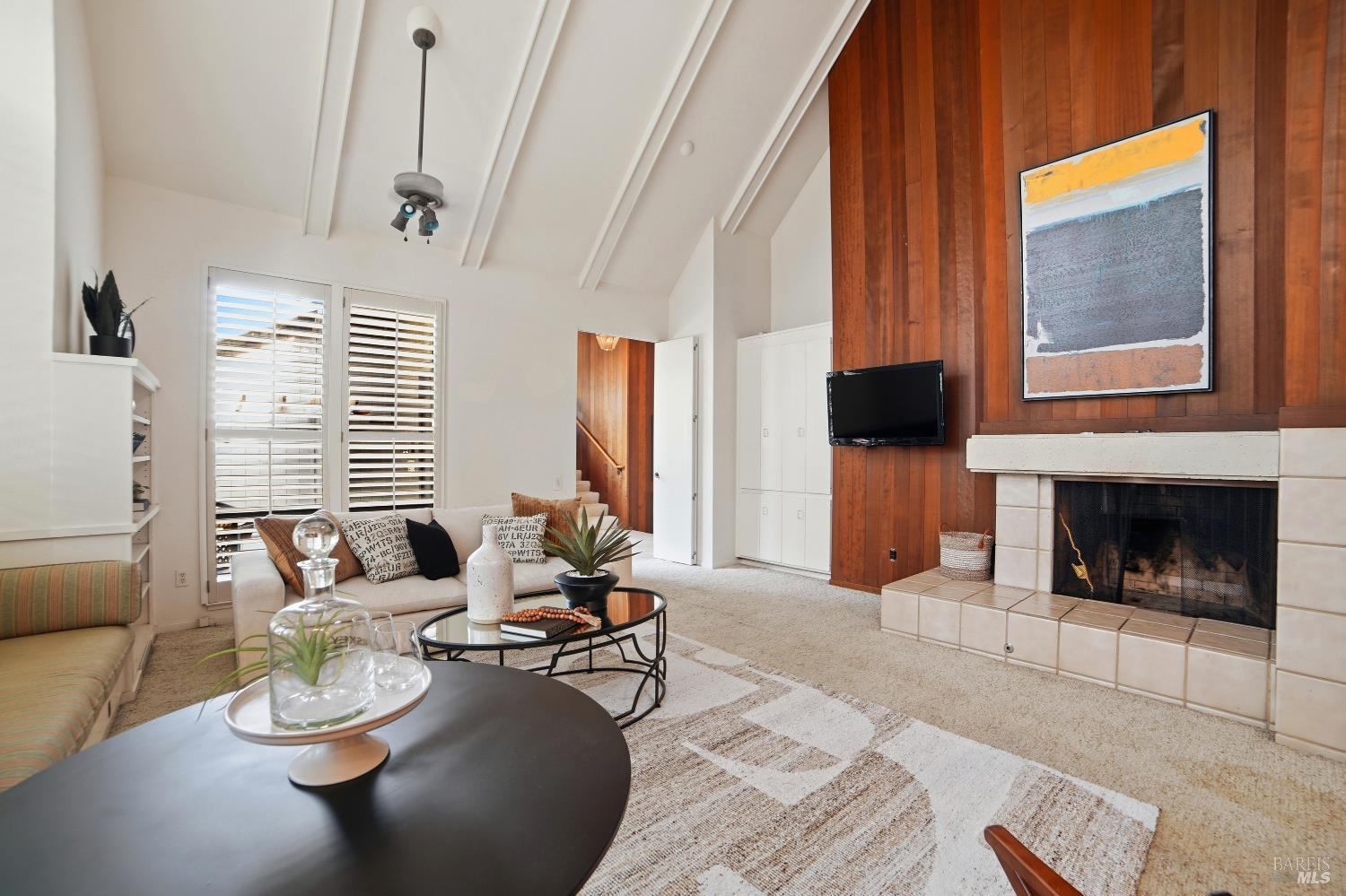 2656 Fir Park Way Santa Rosa, CA 95404 - Photo 8 of 51 a living room with furniture a fireplace and a flat screen tv