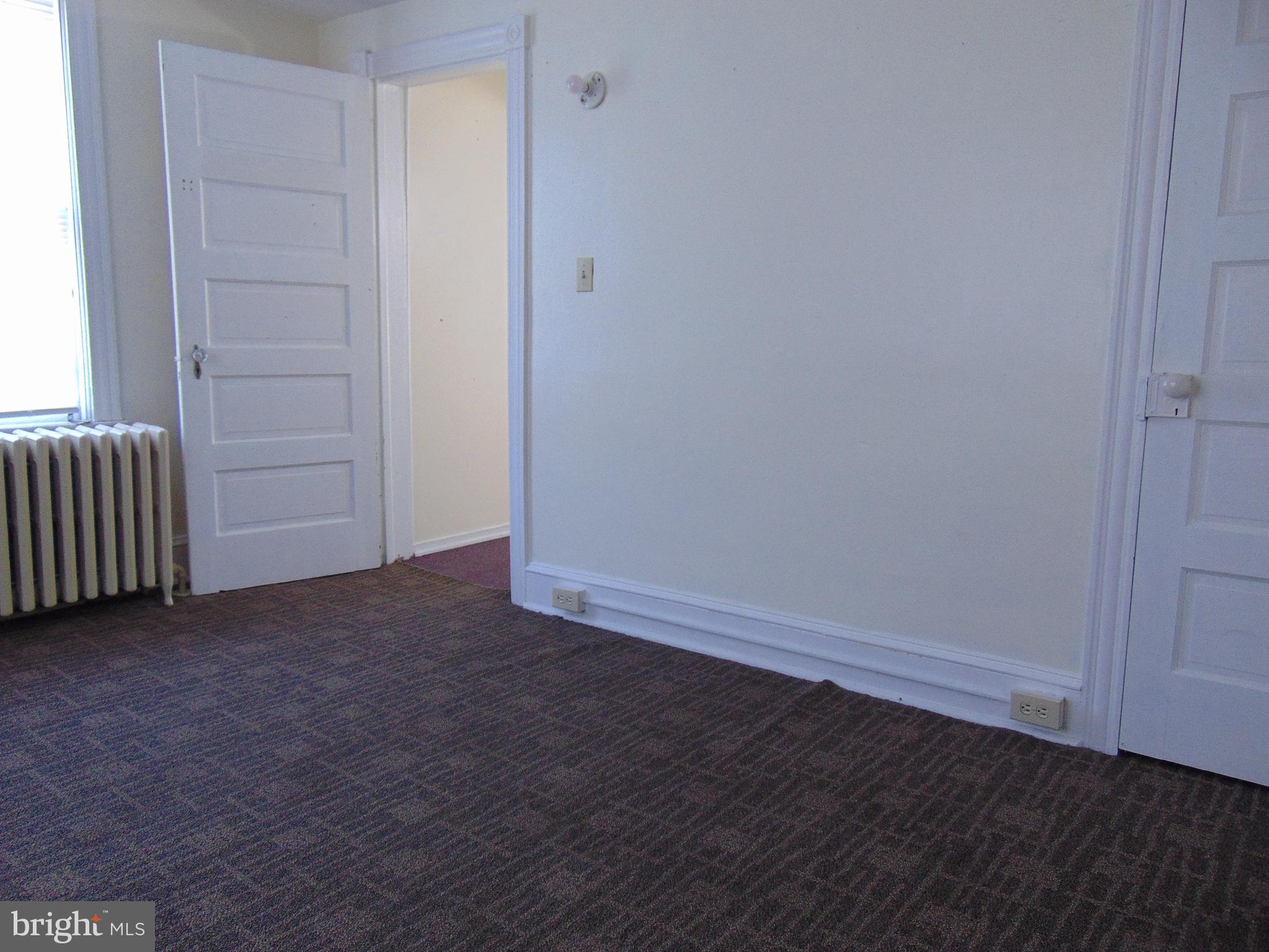 24 East Ridge Street Coaldale, PA 18218 - Photo 14 of 38 an empty room with wooden floor and windows