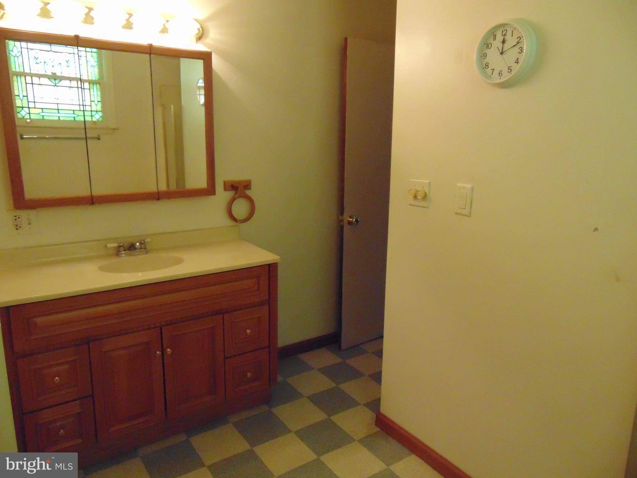 24 East Ridge Street Coaldale, PA 18218 - Photo 20 of 38 a bathroom with a sink and a mirror