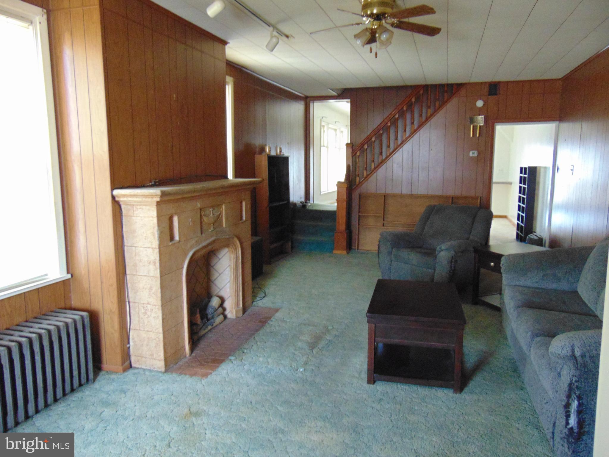24 East Ridge Street Coaldale, PA 18218 - Photo 26 of 38 a living room with furniture and a fireplace