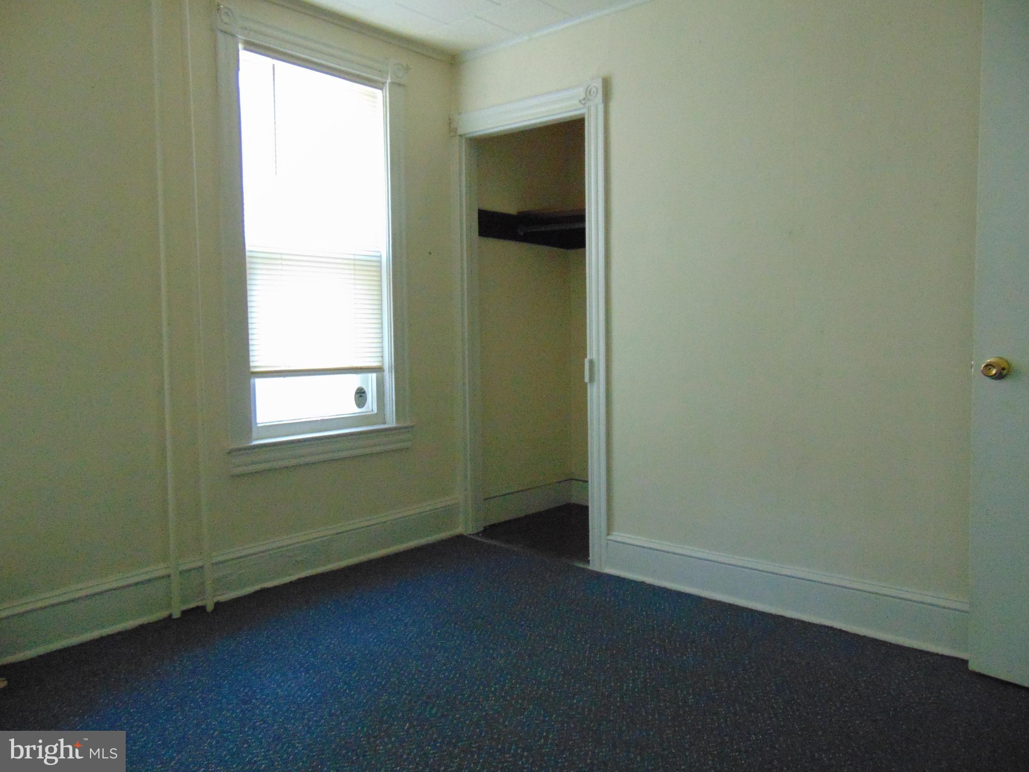 24 East Ridge Street Coaldale, PA 18218 - Photo 7 of 38 an empty room with a window and a ceiling fan