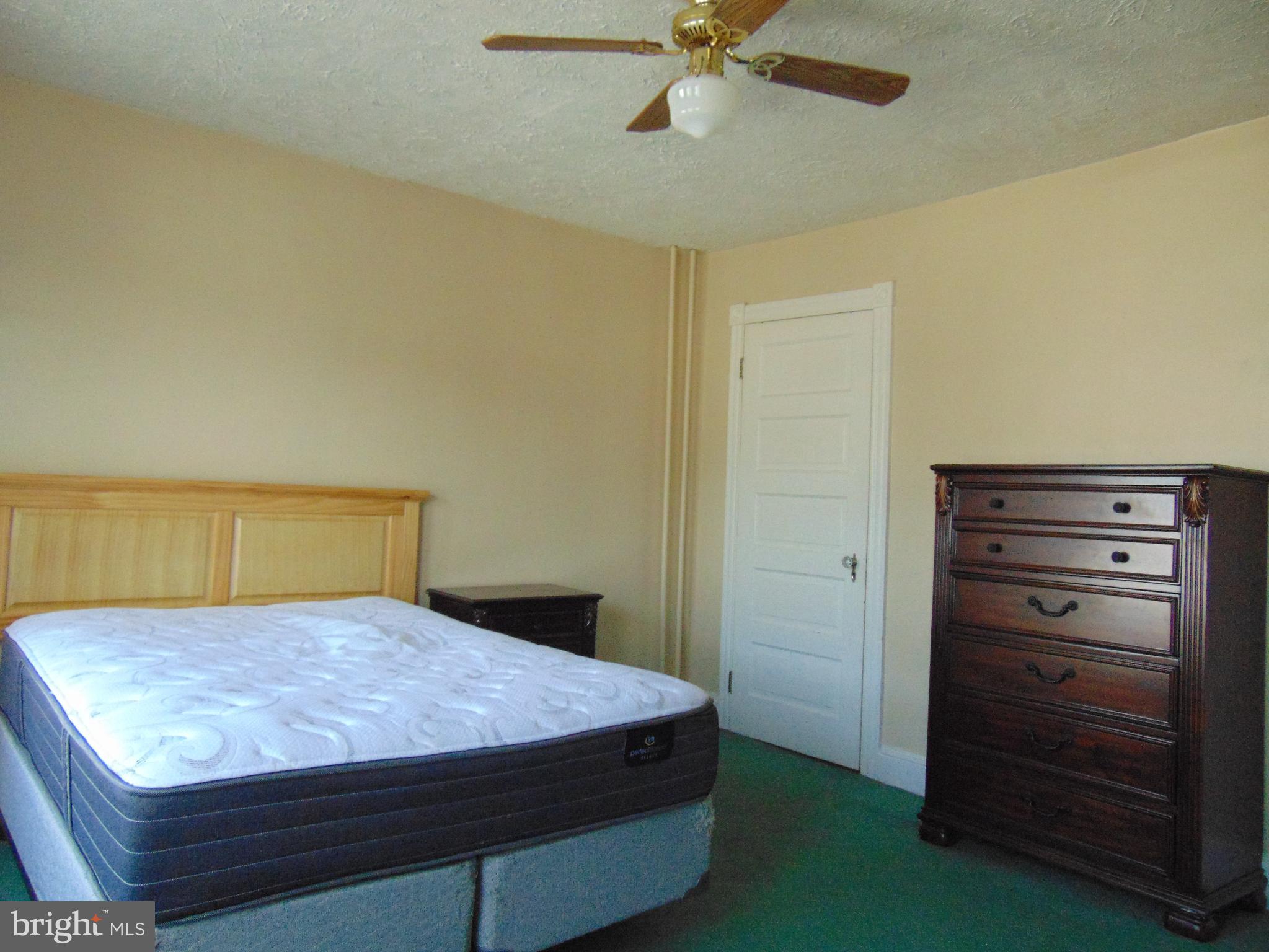 24 East Ridge Street Coaldale, PA 18218 - Photo 9 of 38 a bedroom with a bed and a ceiling fan