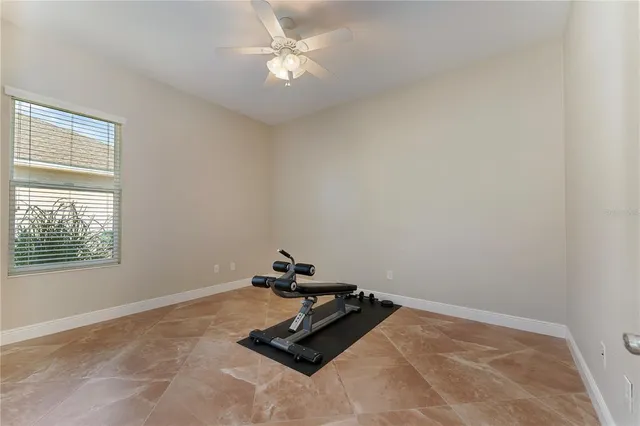 a room with gym equipment and a window