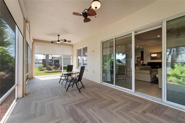 a view of a livingroom with furniture window and wooden floor
