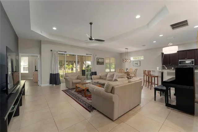 a living room with fireplace furniture and a flat screen tv
