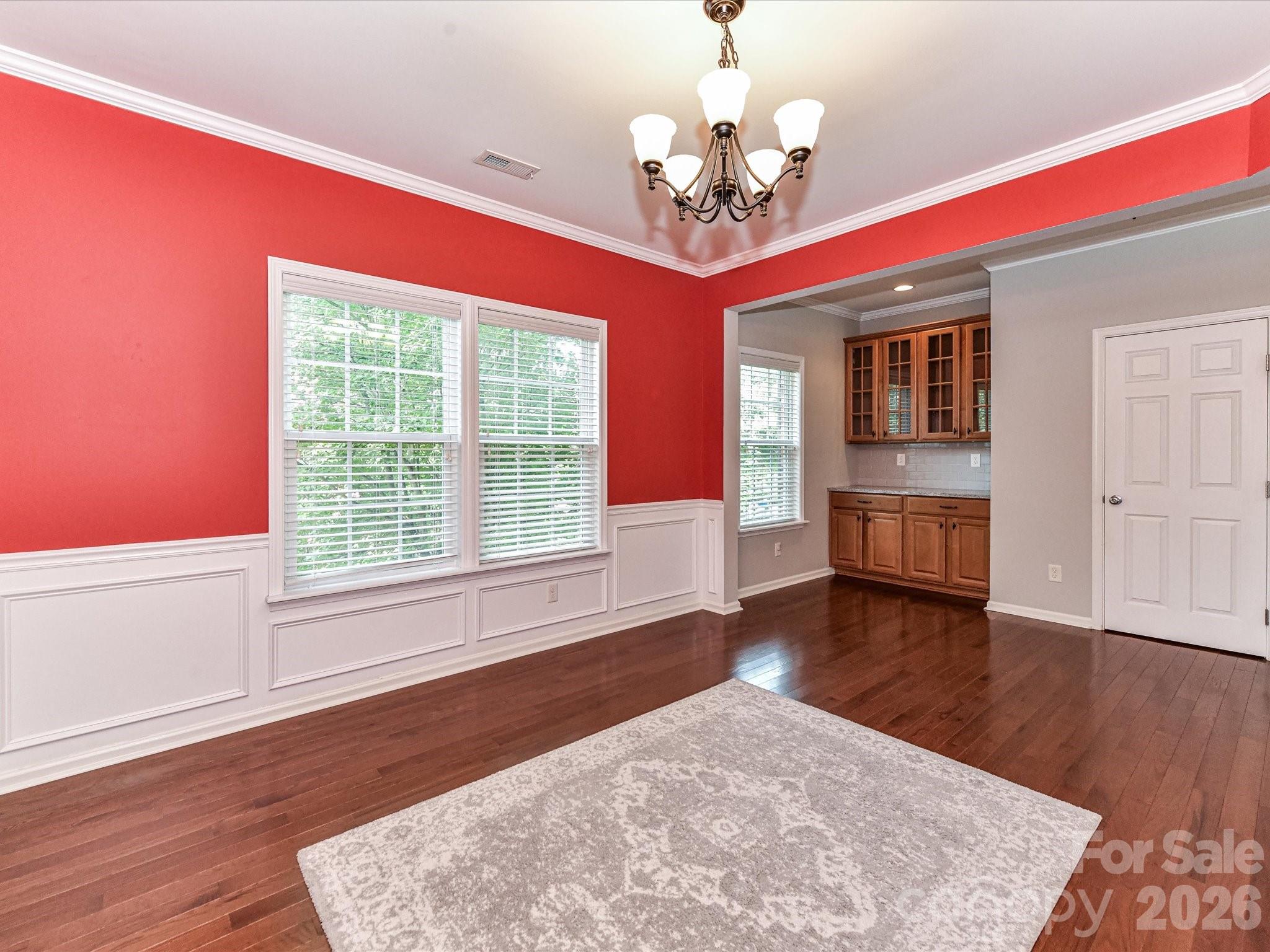 756 Naramore Street Davidson, NC 28036 - Photo 13 of 44 a view of livingroom with hardwood floor and window