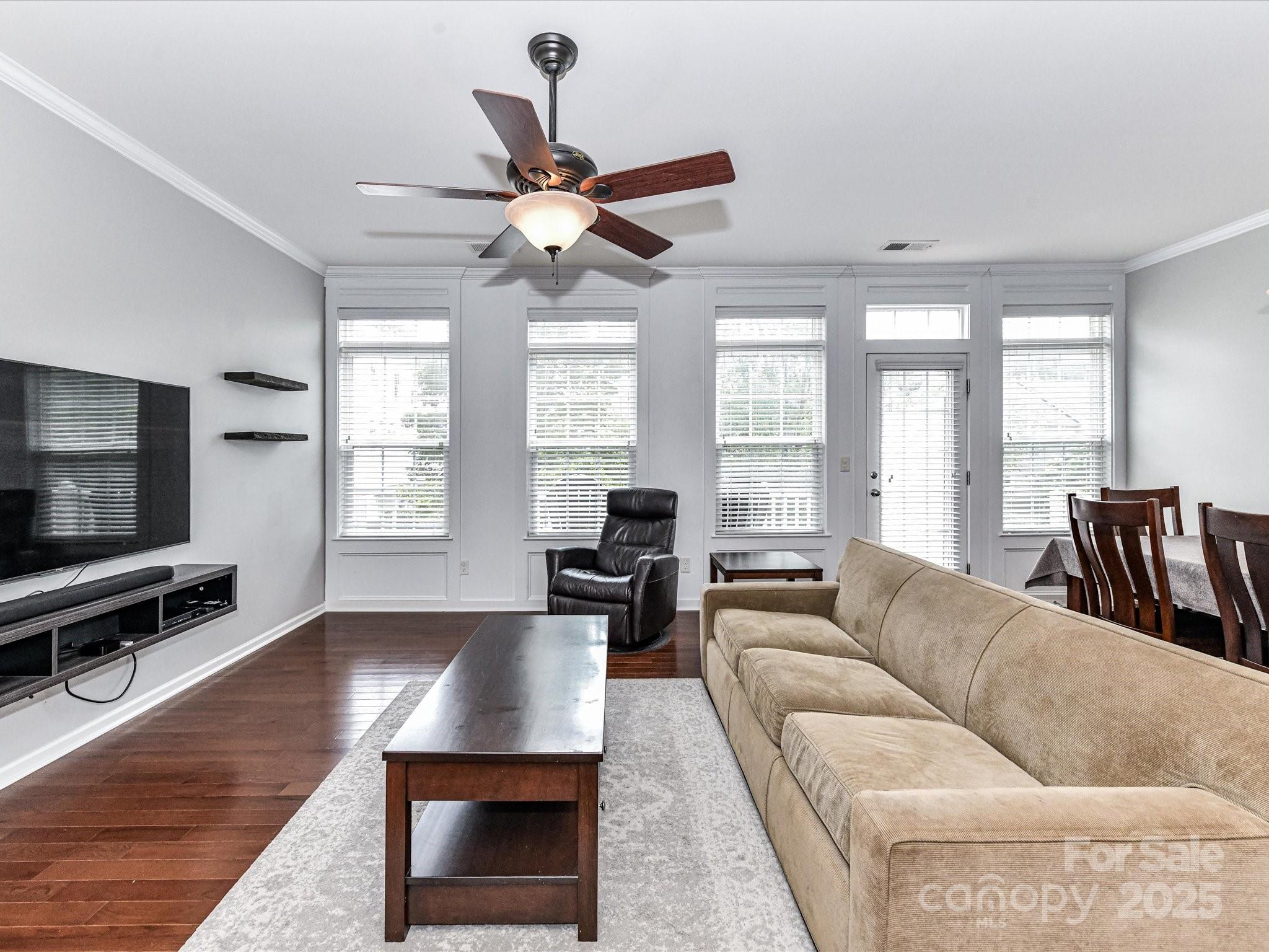 756 Naramore Street Davidson, NC 28036 - Photo 15 of 46 a living room with furniture and a flat screen tv
