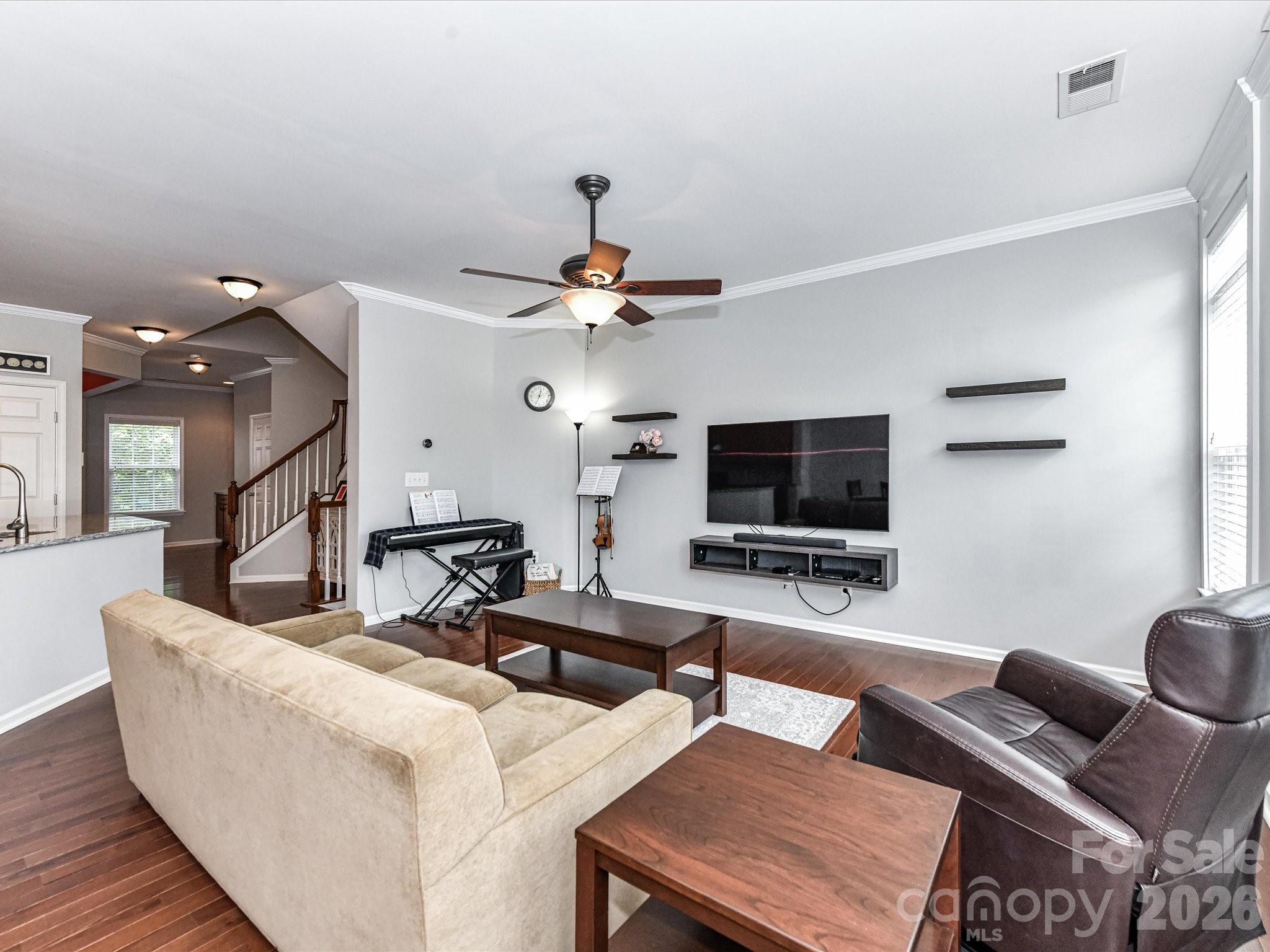 756 Naramore Street Davidson, NC 28036 - Photo 16 of 44 a living room with couches and a flat screen tv