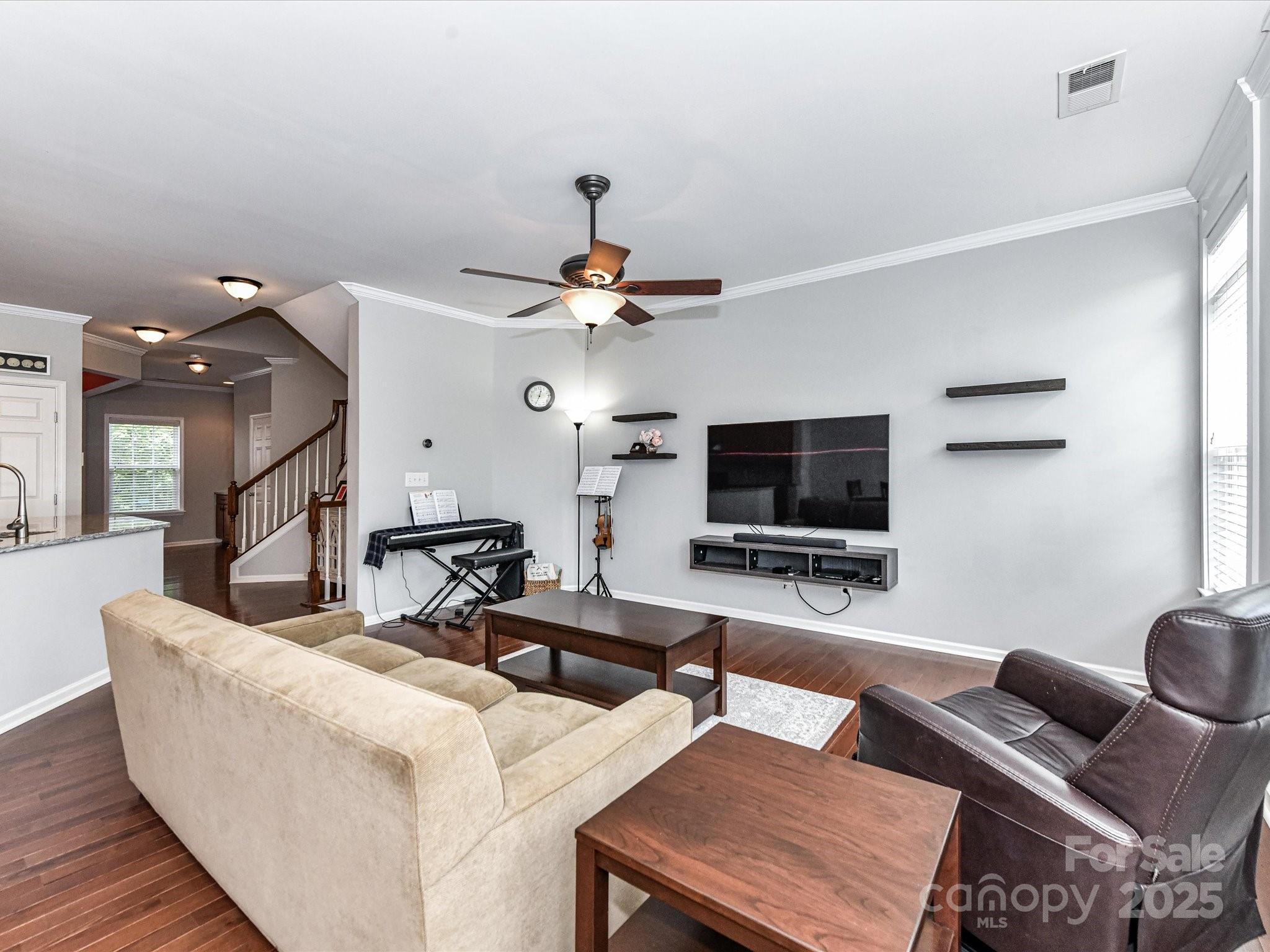 756 Naramore Street Davidson, NC 28036 - Photo 17 of 46 a living room with couches and a flat screen tv