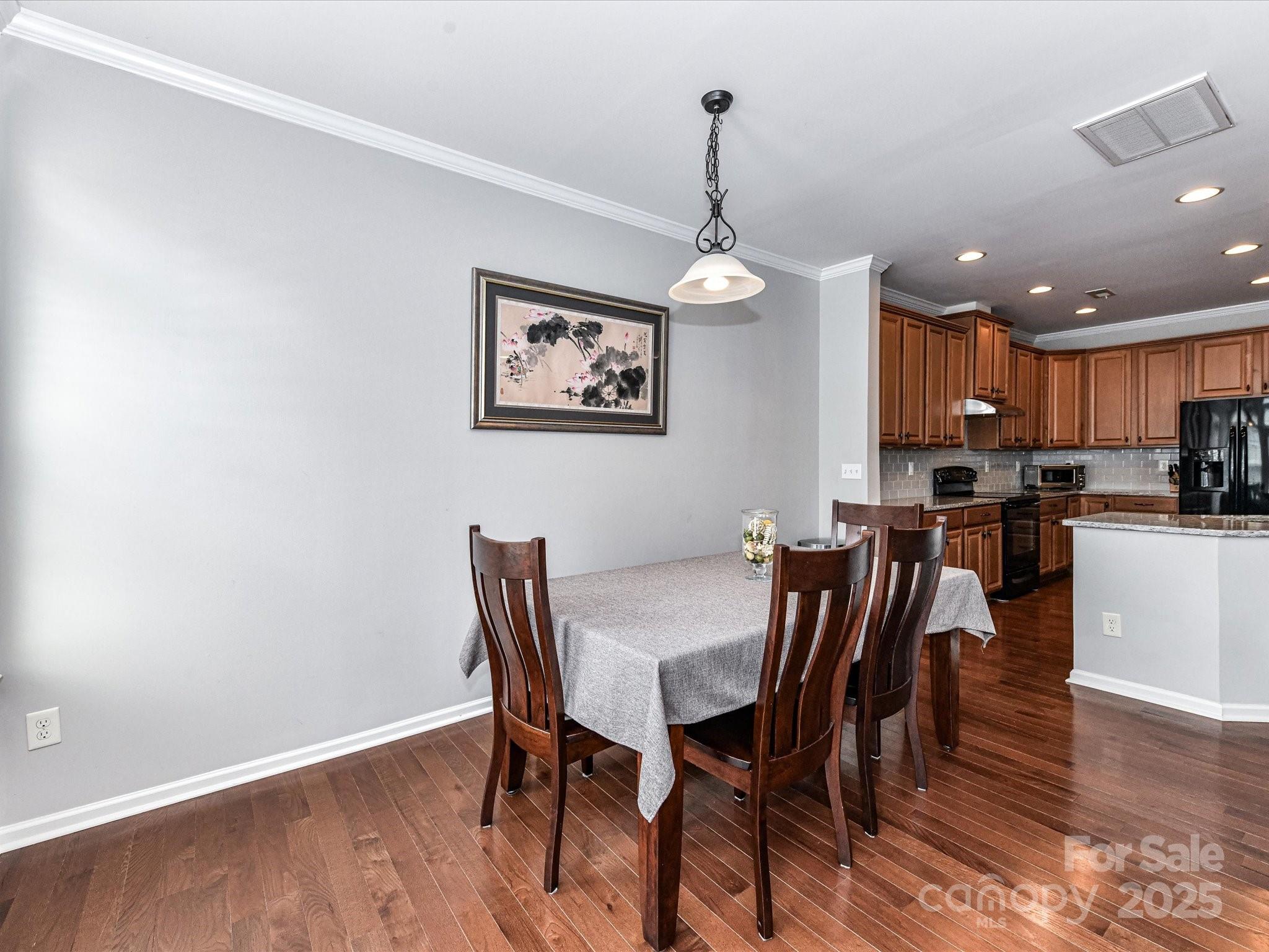 756 Naramore Street Davidson, NC 28036 - Photo 25 of 46 a view of a dining room with furniture