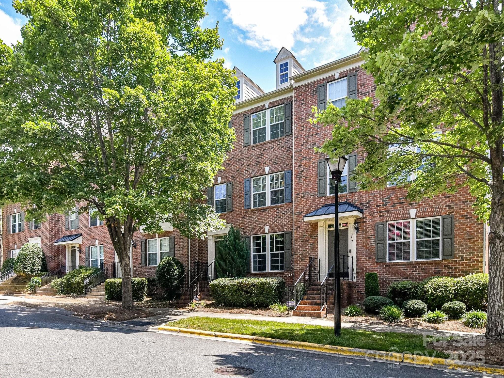 756 Naramore Street Davidson, NC 28036 - Photo 3 of 46 a front view of a house with garden