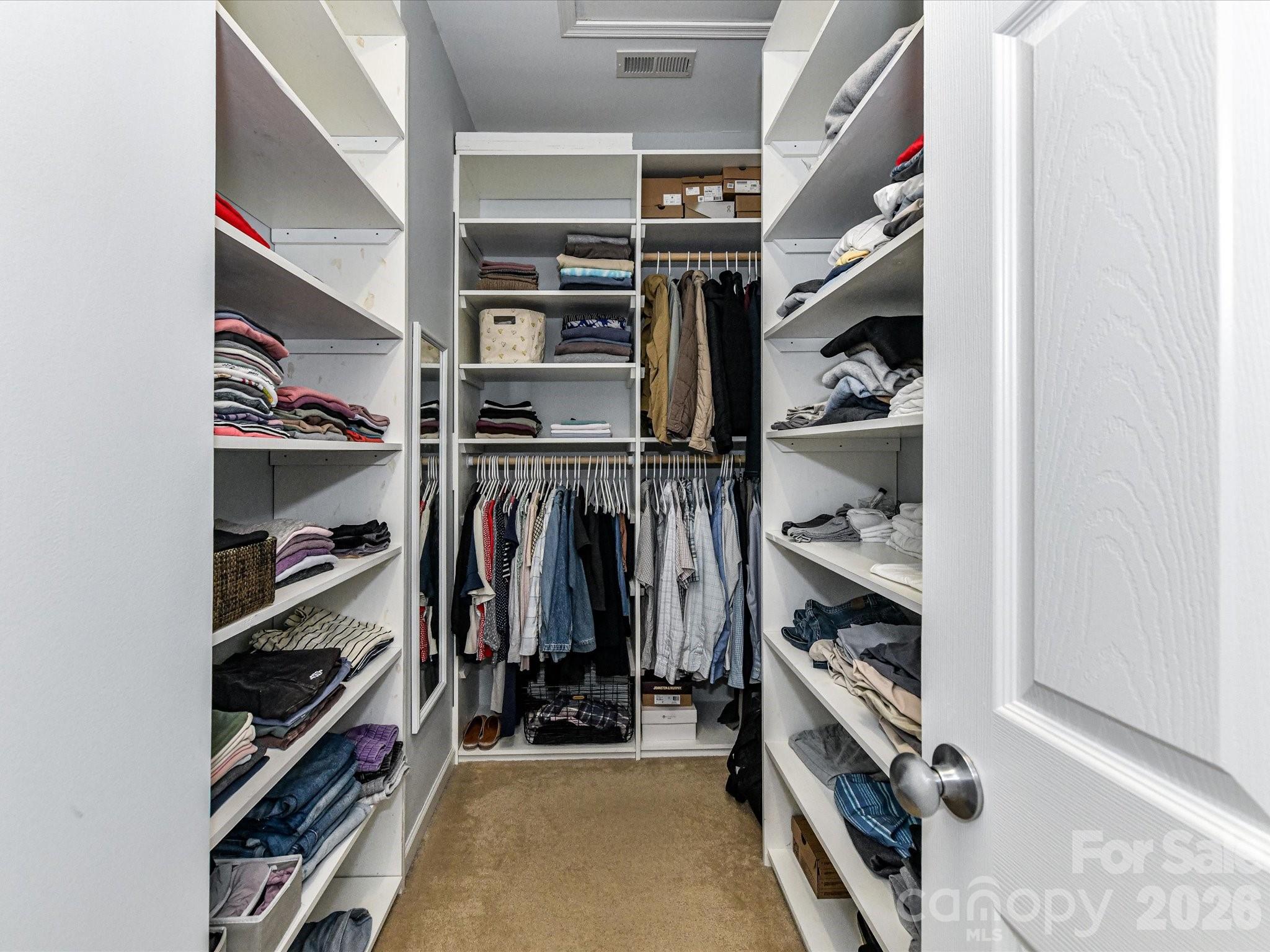 756 Naramore Street Davidson, NC 28036 - Photo 35 of 44 a view of walk in closet with clothes and shoes
