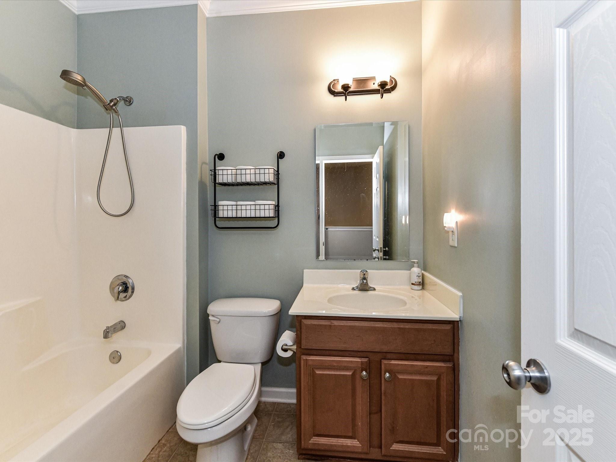 756 Naramore Street Davidson, NC 28036 - Photo 39 of 46 a bathroom with a sink a toilet and shower