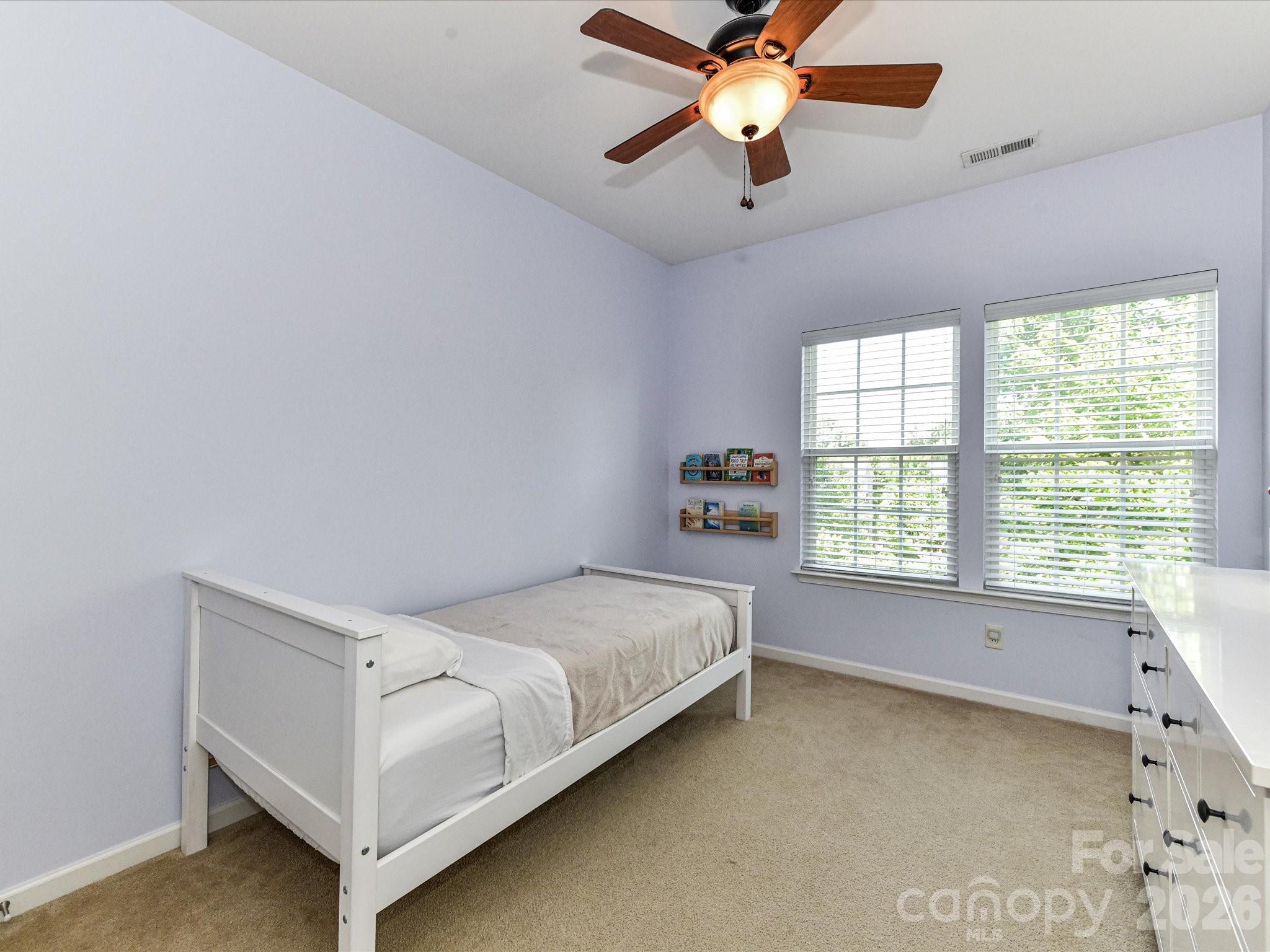 756 Naramore Street Davidson, NC 28036 - Photo 39 of 44 a bedroom with a bed and window