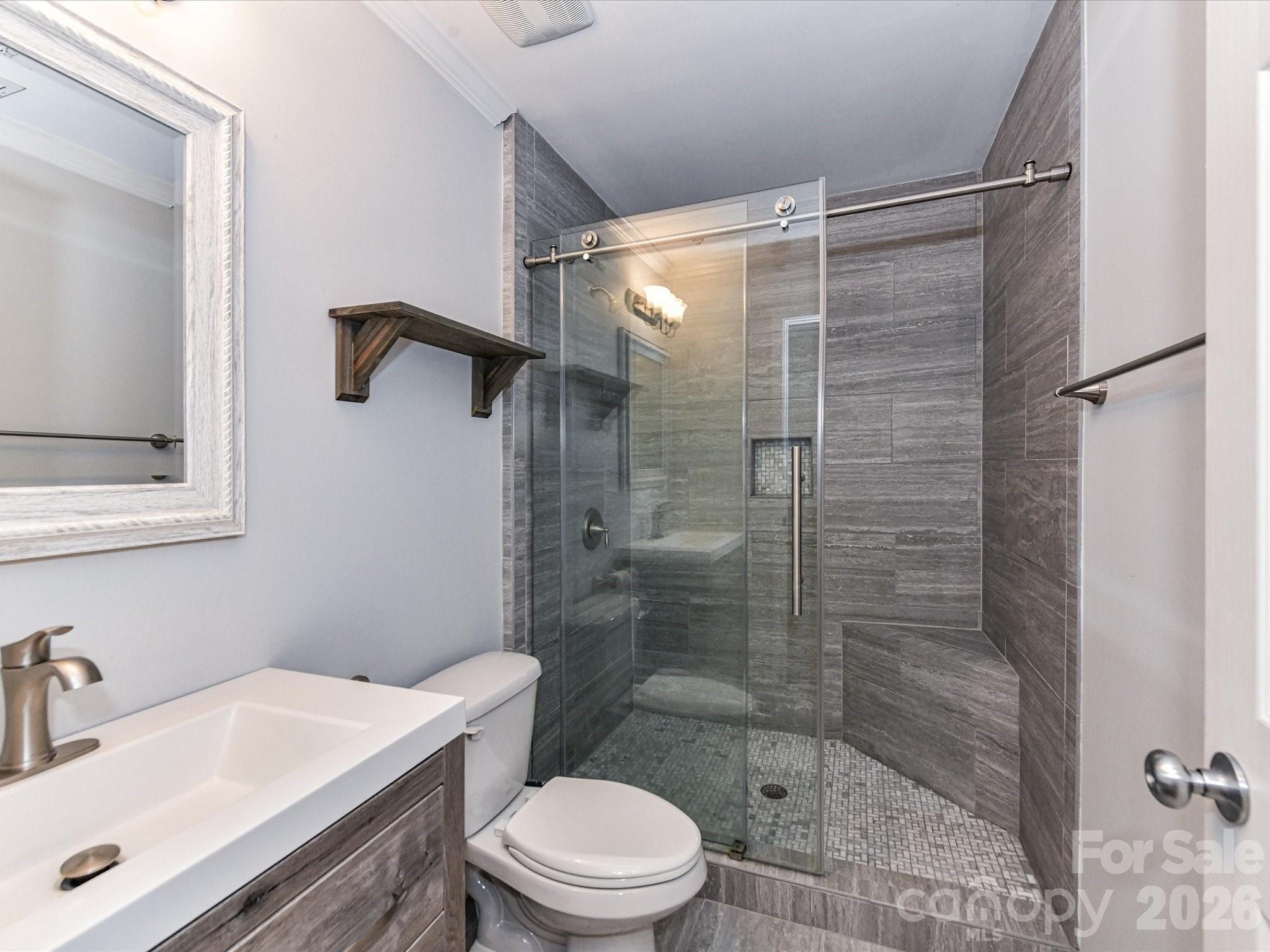 756 Naramore Street Davidson, NC 28036 - Photo 41 of 44 a bathroom with a sink toilet and shower