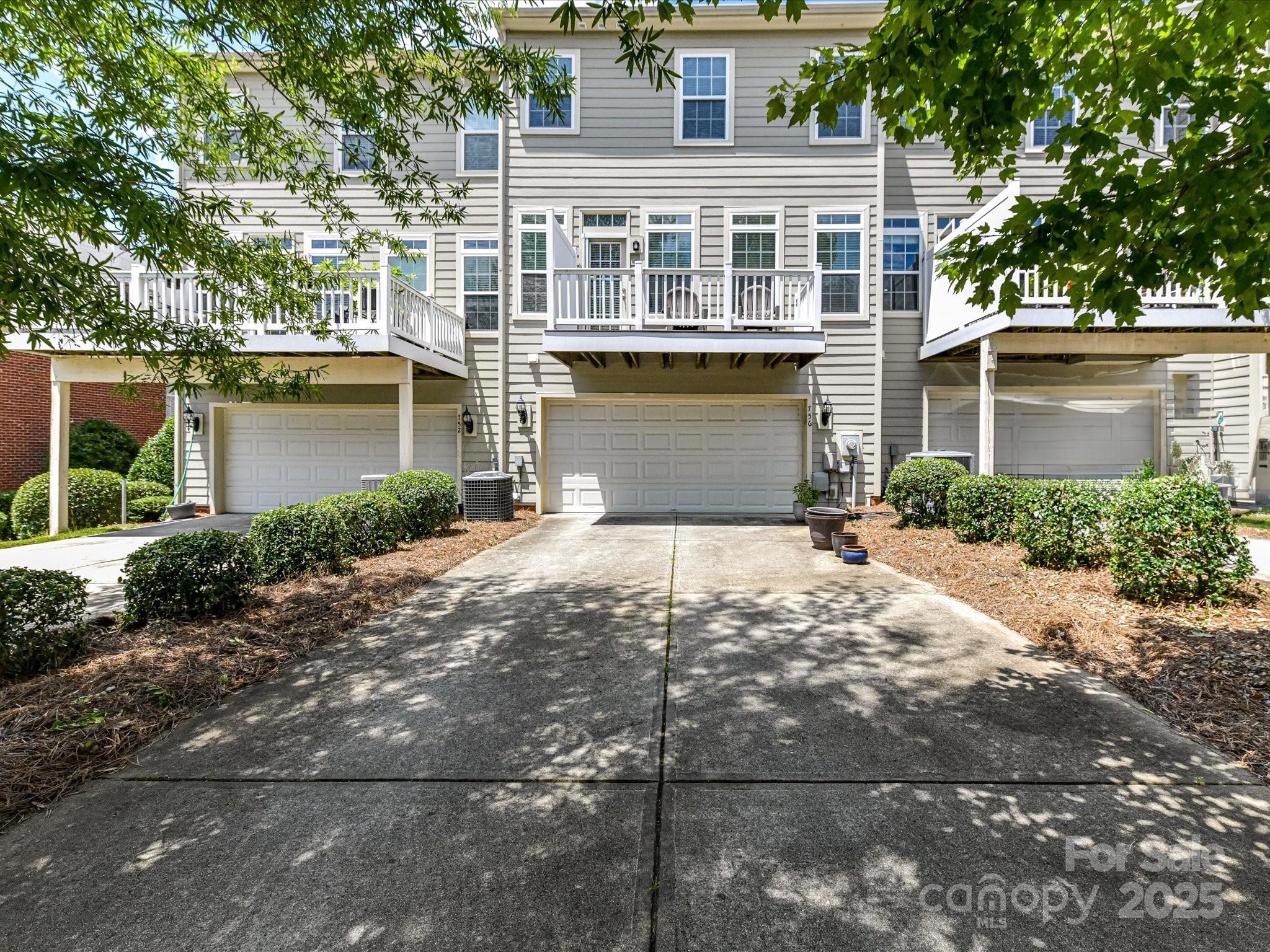 756 Naramore Street Davidson, NC 28036 - Photo 45 of 46 a front view of a house with a yard and garage