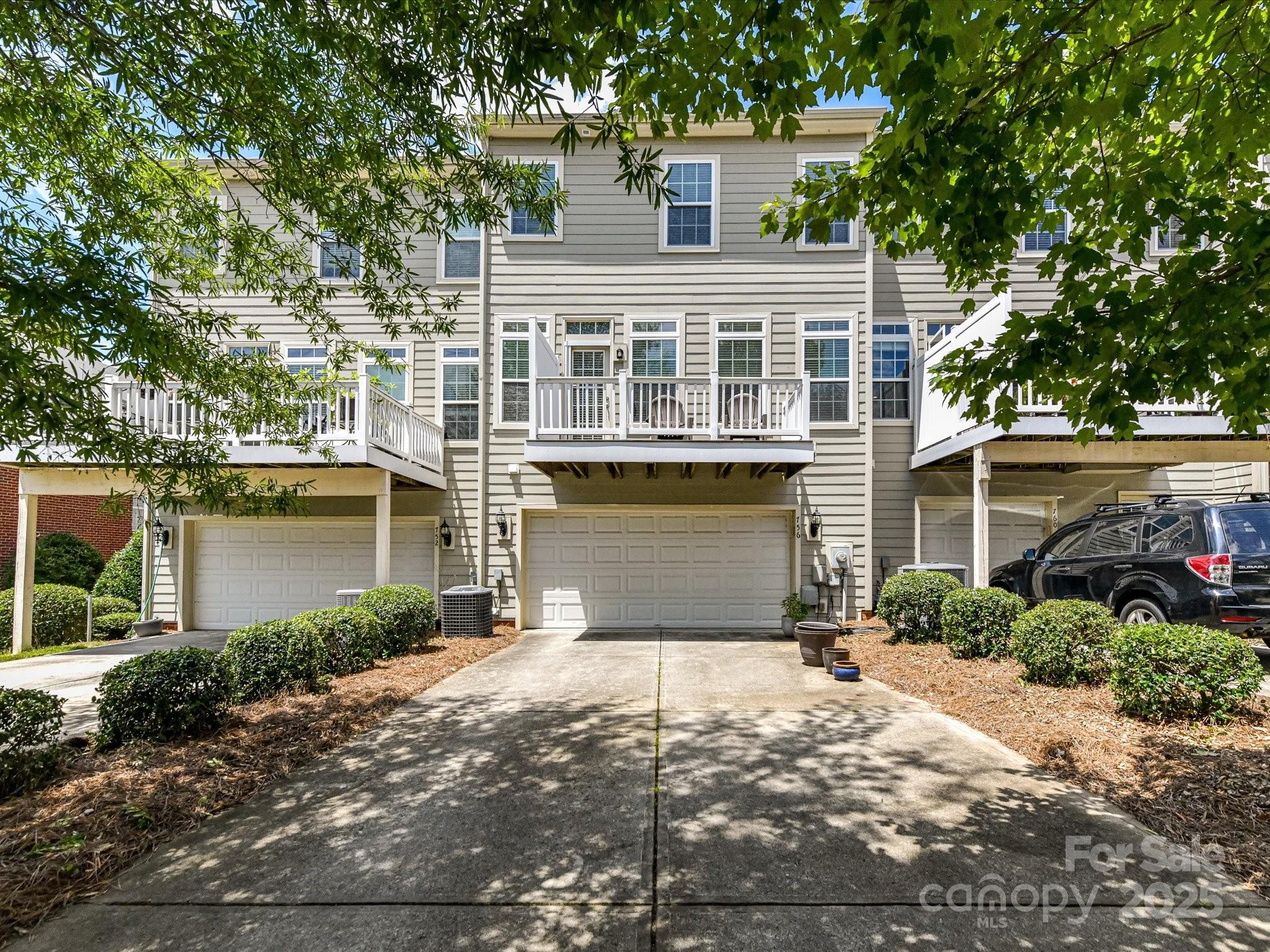 756 Naramore Street Davidson, NC 28036 - Photo 46 of 46 a front view of a house with a yard and garage