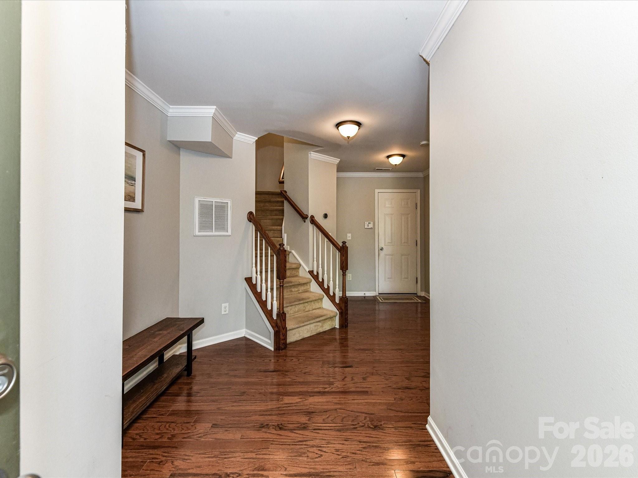 756 Naramore Street Davidson, NC 28036 - Photo 6 of 44 a view of entryway and hall with wooden floor