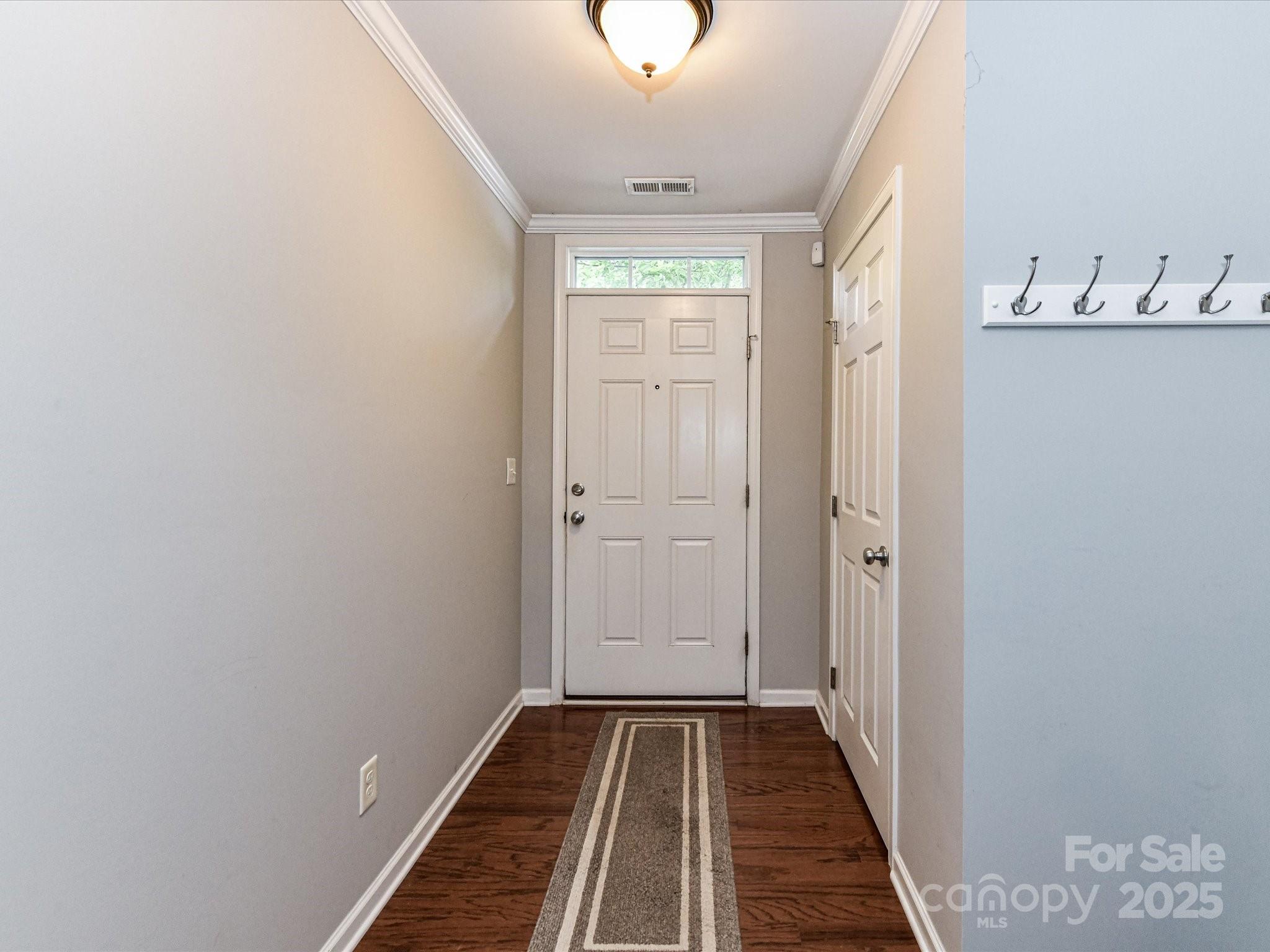 756 Naramore Street Davidson, NC 28036 - Photo 7 of 46 a view of a livingroom with wooden floor and a window