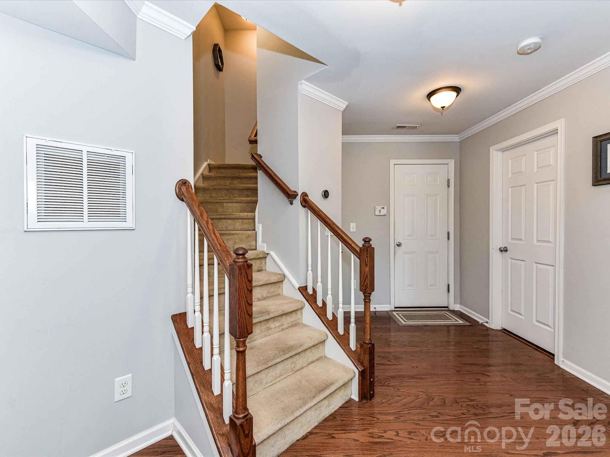 756 Naramore Street Davidson, NC 28036 - Photo 8 of 44 a view of a hallway with windows and wooden floor