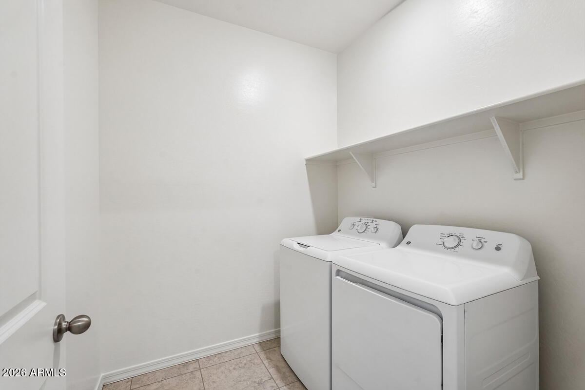 31690 Rodeo Road San Tan Valley, AZ 85140 - Photo 28 of 35 a utility room with dryer and washer