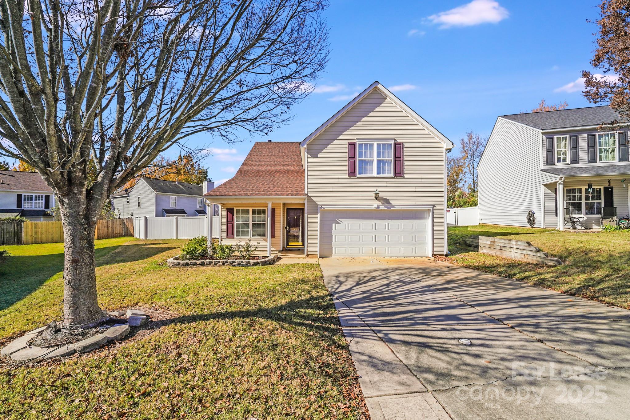 1427 Jabbok Place Northwest Concord, NC 28027 - Photo 1 of 30 a front view of a house with garden