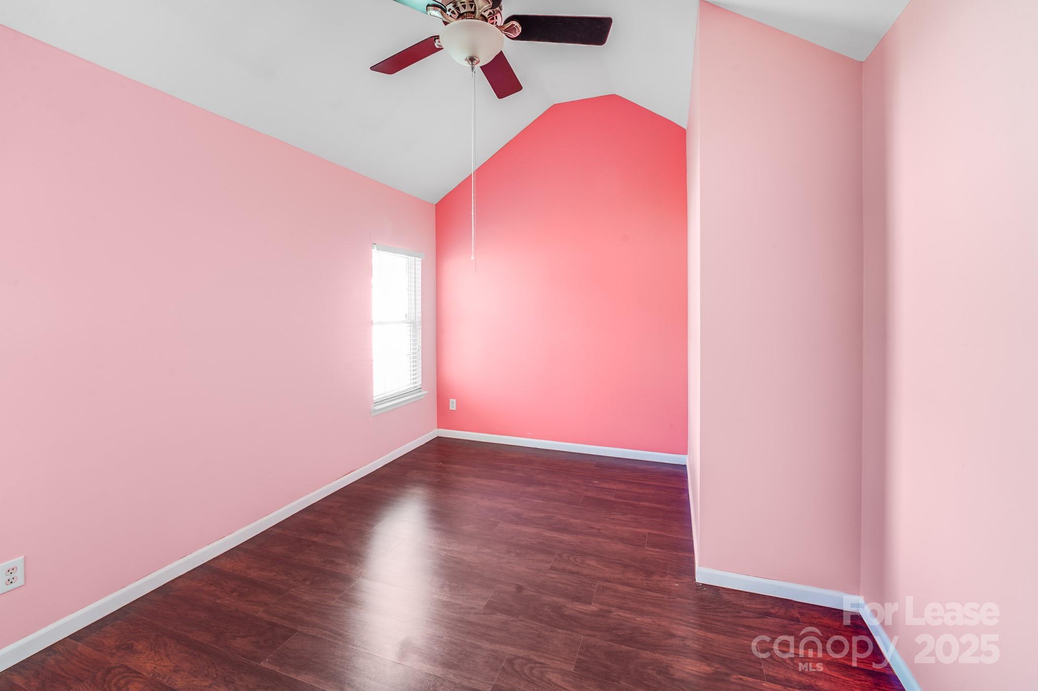 1427 Jabbok Place Northwest Concord, NC 28027 - Photo 16 of 30 an empty room with wooden floor and windows