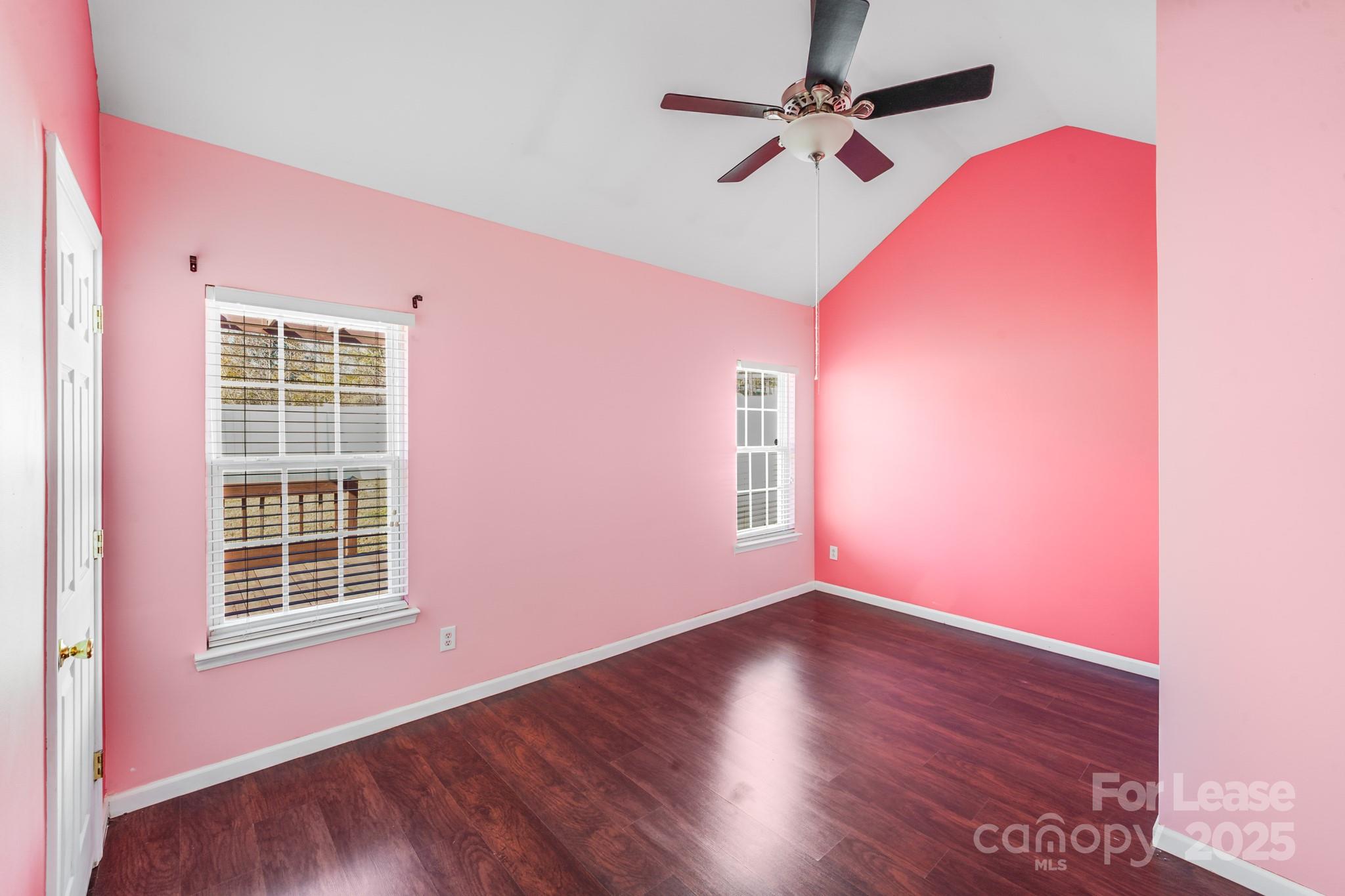 1427 Jabbok Place Northwest Concord, NC 28027 - Photo 17 of 30 a view of an empty room with wooden floor and a window