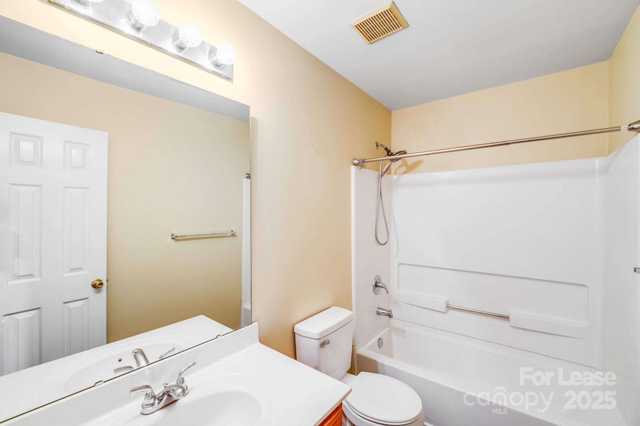 1427 Jabbok Place Northwest Concord, NC 28027 - Photo 25 of 30 a bathroom with a sink a toilet and shower