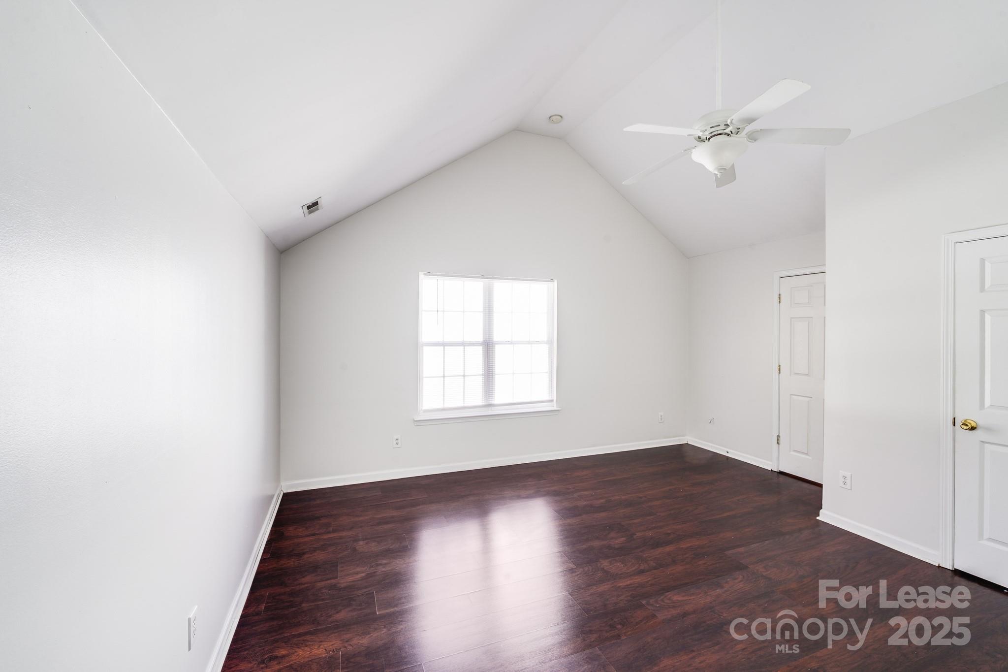 1427 Jabbok Place Northwest Concord, NC 28027 - Photo 27 of 30 a view of an empty room with wooden floor and a window