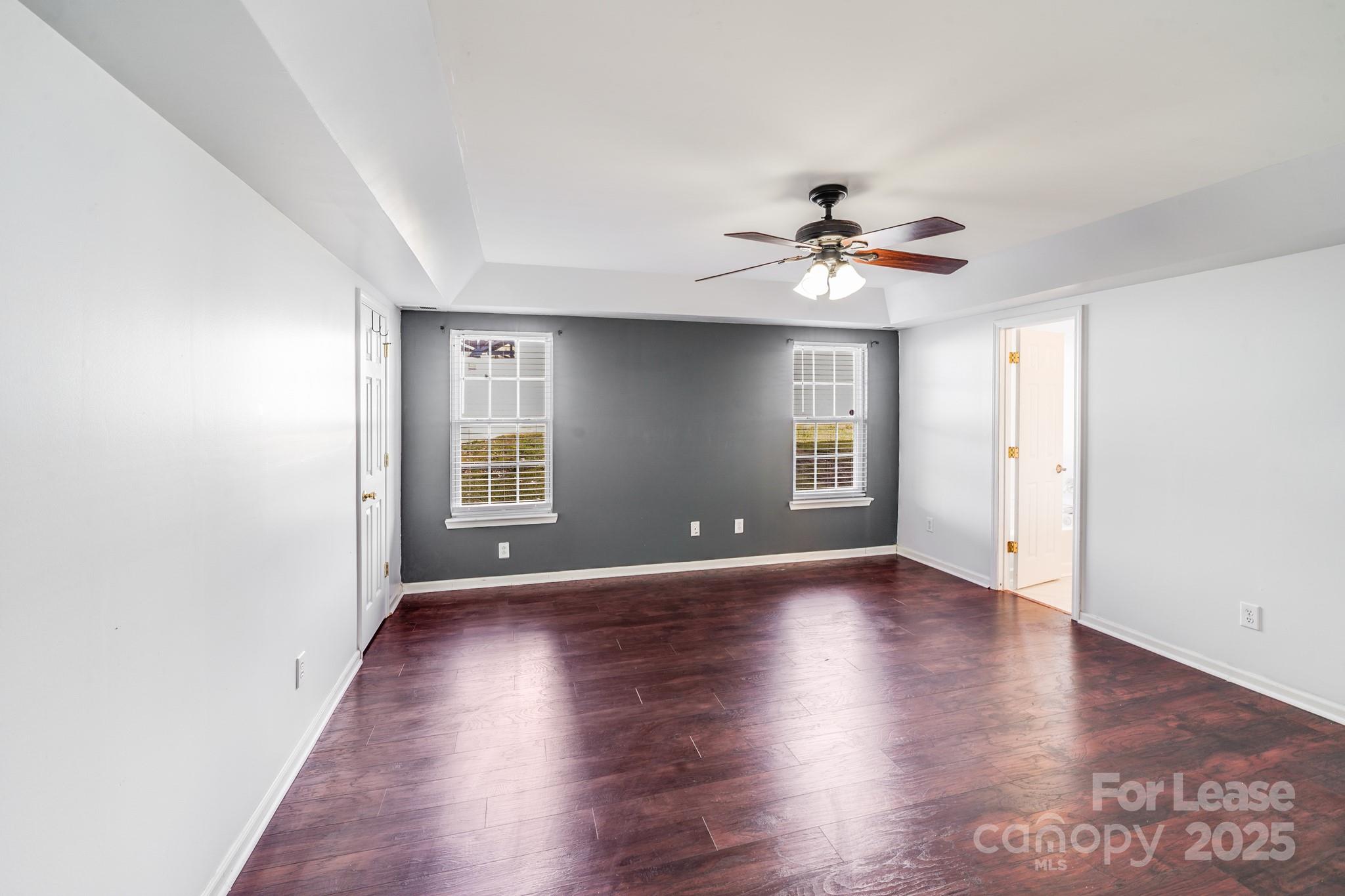 1427 Jabbok Place Northwest Concord, NC 28027 - Photo 4 of 30 a view of an empty room with window and wooden floor