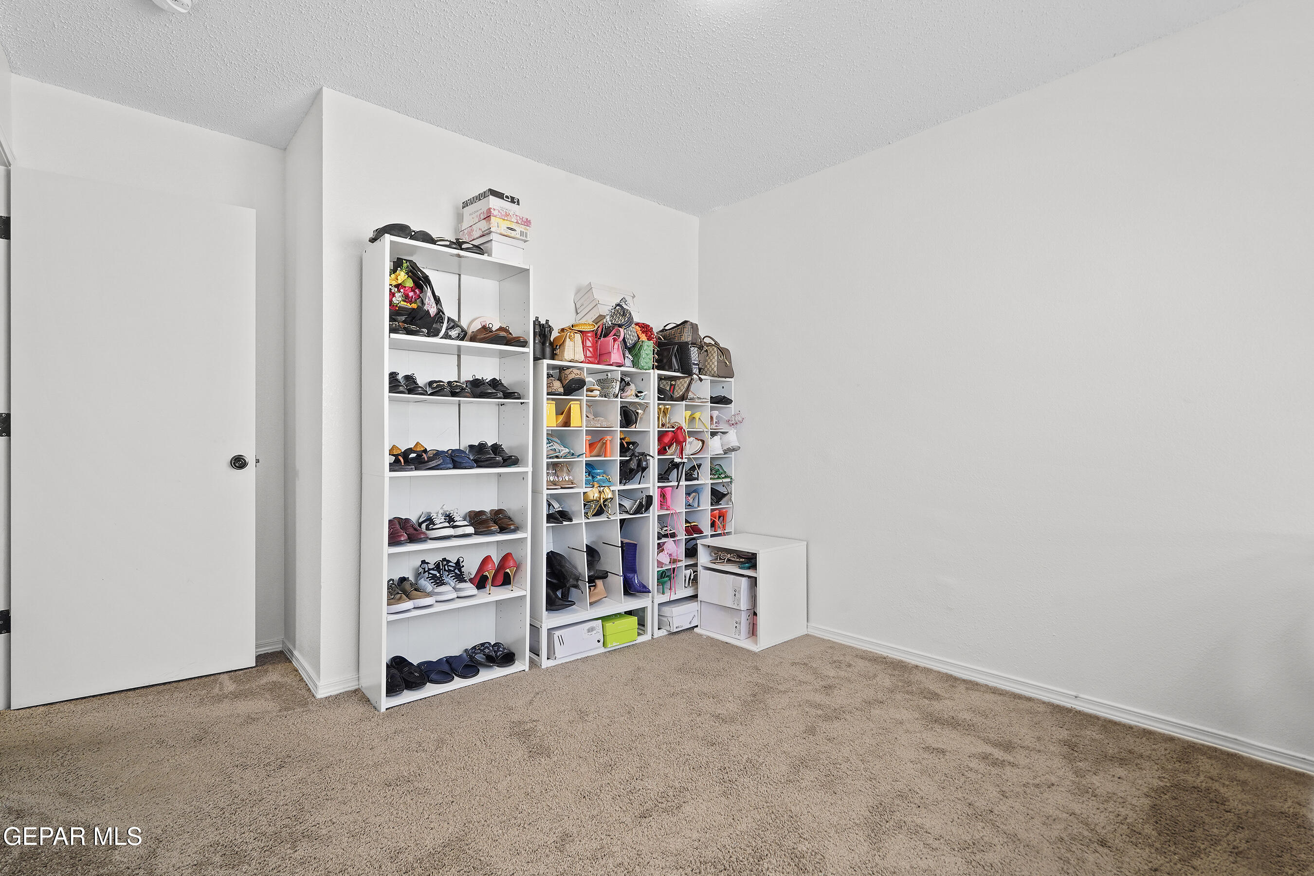 12733 Raul Mendiola Lane El Paso, TX 79938 - Photo 11 of 30 a room with toys and a book shelf