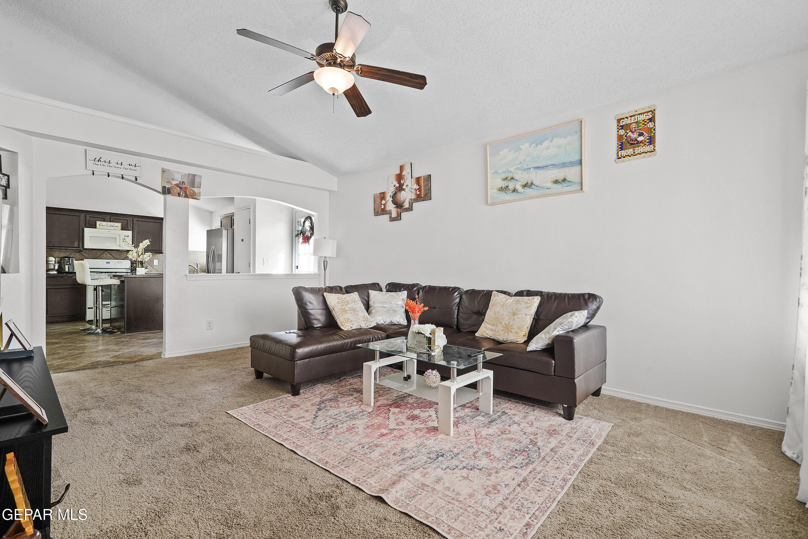 12733 Raul Mendiola Lane El Paso, TX 79938 - Photo 12 of 30 a living room with furniture and a flat screen tv