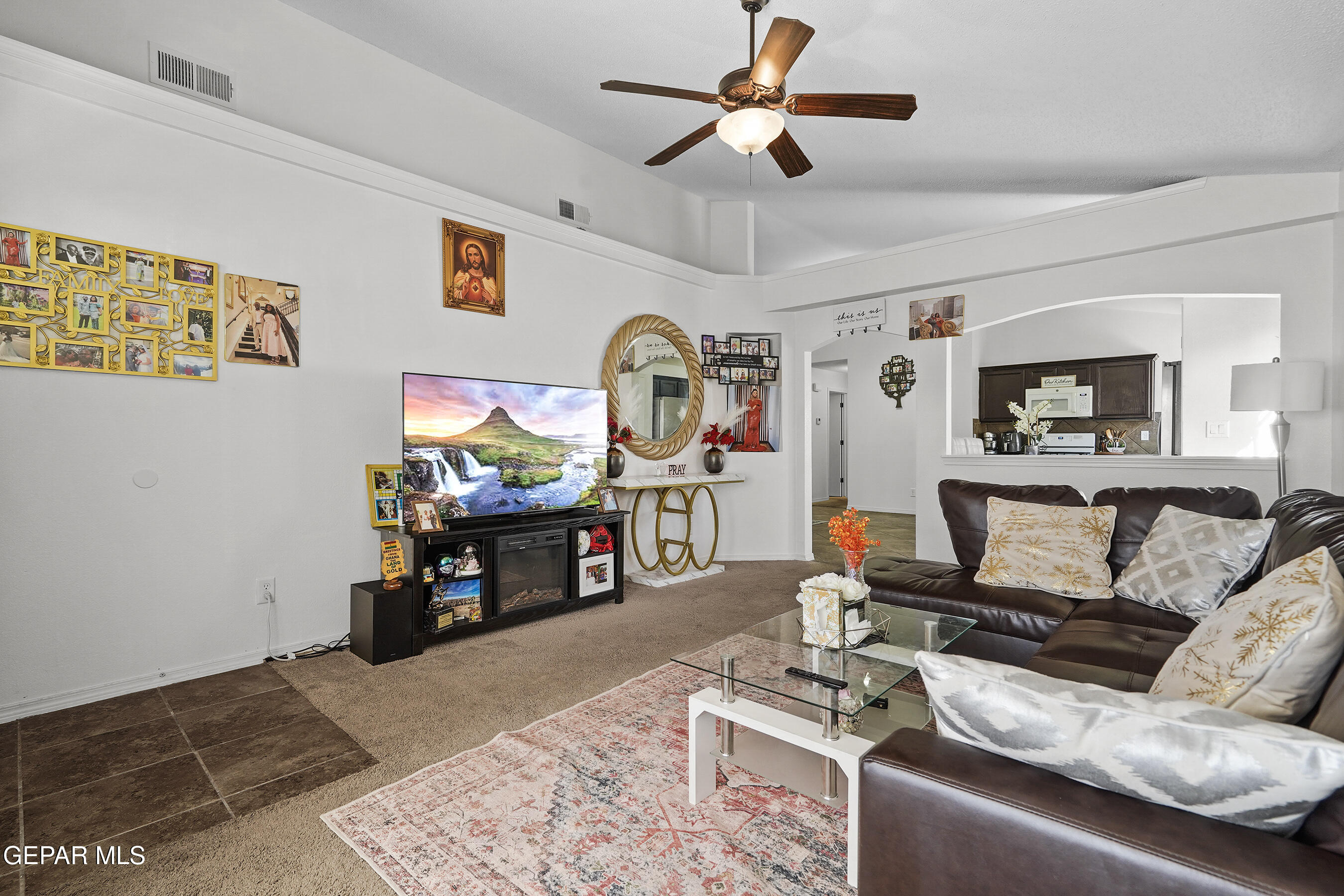 12733 Raul Mendiola Lane El Paso, TX 79938 - Photo 13 of 30 a living room with furniture and a flat screen tv