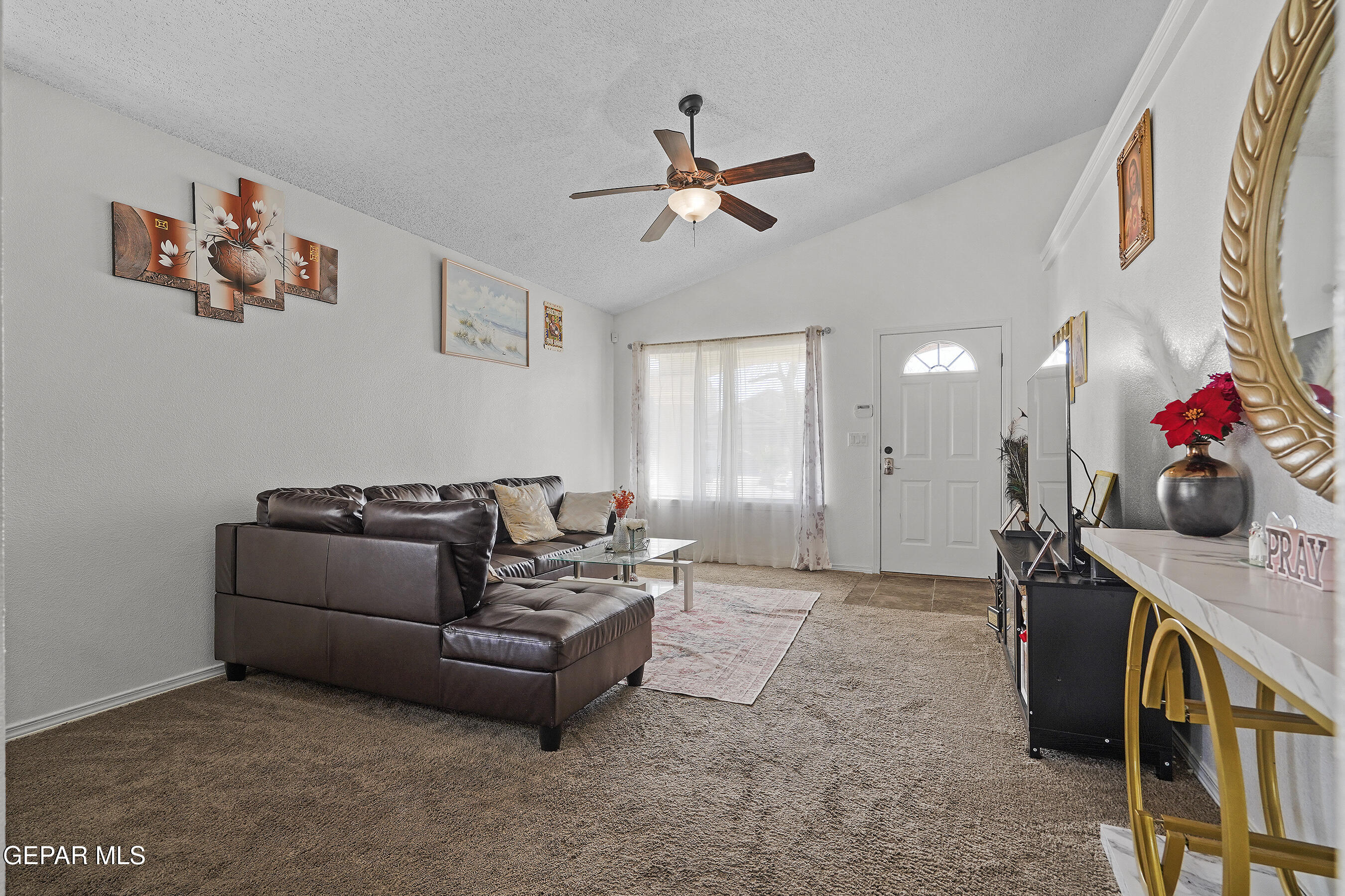12733 Raul Mendiola Lane El Paso, TX 79938 - Photo 14 of 30 a living room with furniture and a flat screen tv